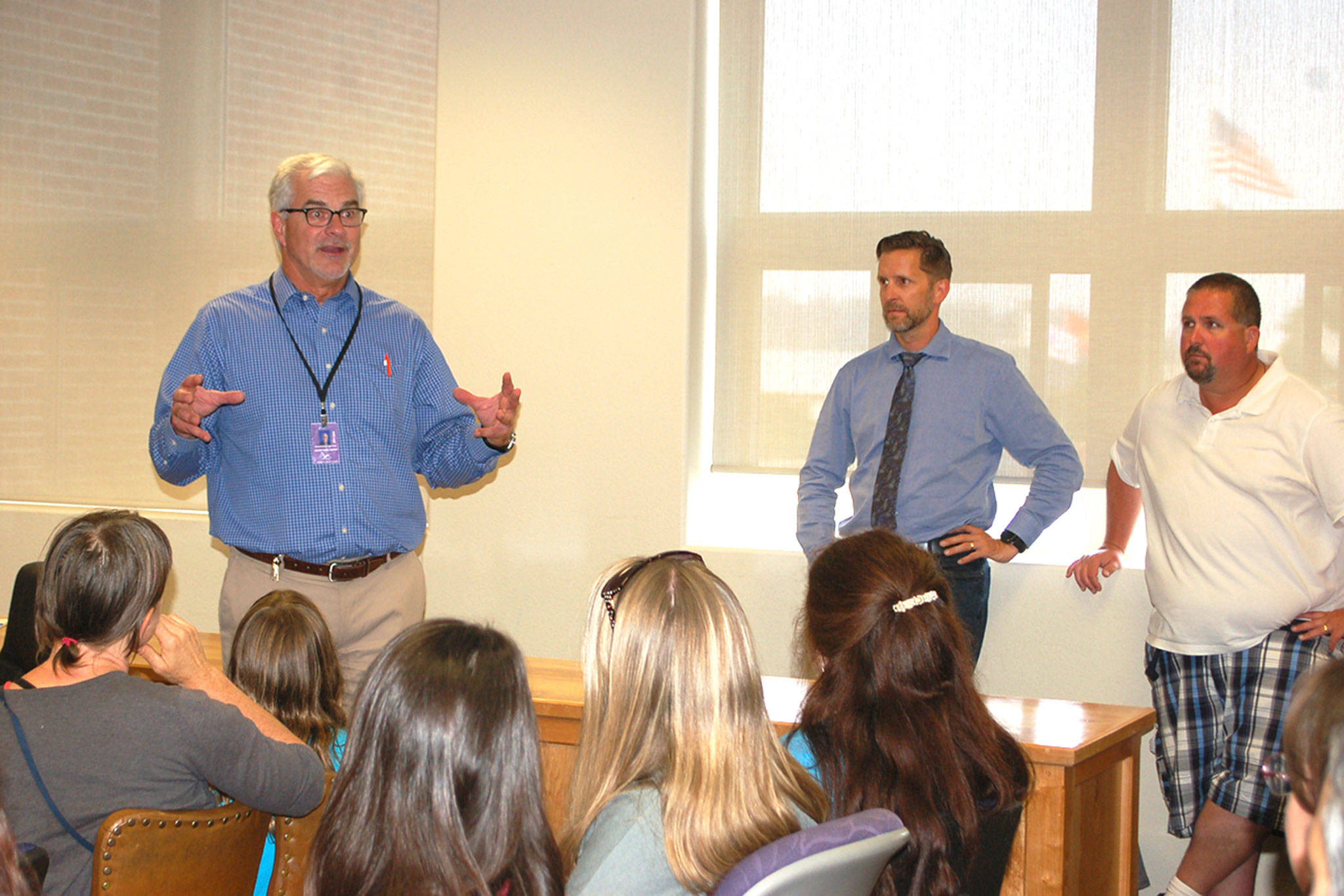 Sequim Schools Superintendent Gary Neal discusses temporary housing for the Olympic Peninsula Academy with the alternative education program’s Parent Teacher Organization, parents and staff. (Erin Hawkins/Olympic Peninsula News Group)
