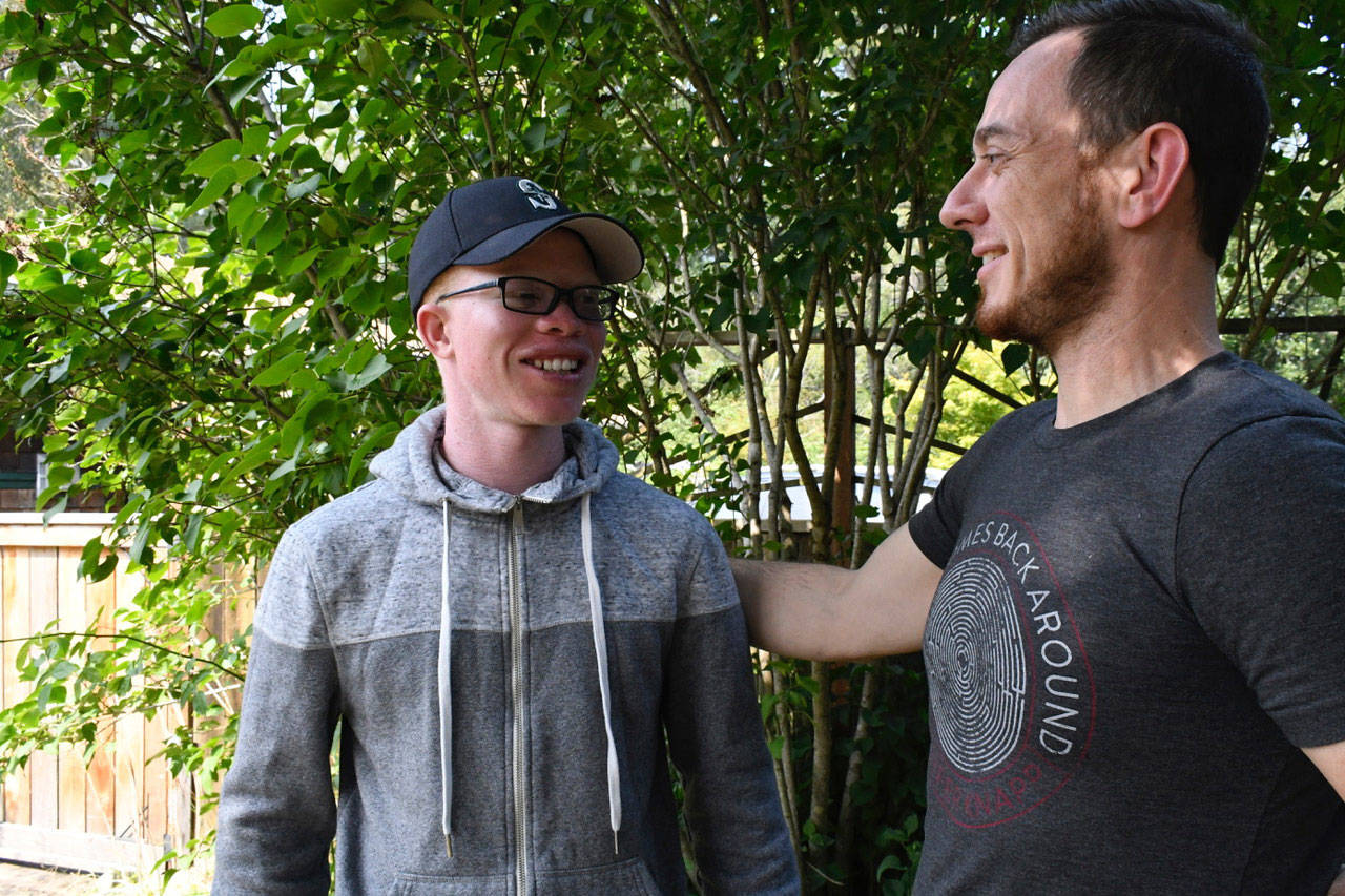 After a long journey from Swaziland, Walter Maphalala, left, visits Port Townsend with Pastor Tony Brown of Trinity United Methodist Church. The young man was granted a tourist visa. (Jeannie McMacken/Peninsula Daily News)