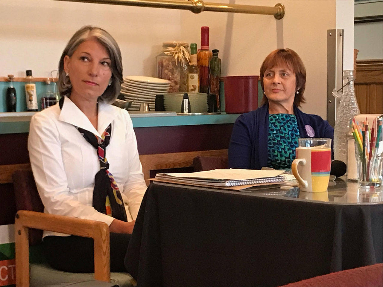 Candidates Mary Ellen Winborn, left, and Julie Gardiner, listened to instructions Tuesday before a voters forum on the Clallam County Department of Community Development director position on the Nov. 7 general election ballot. (Paul Gottlieb/Peninsula Daily News)