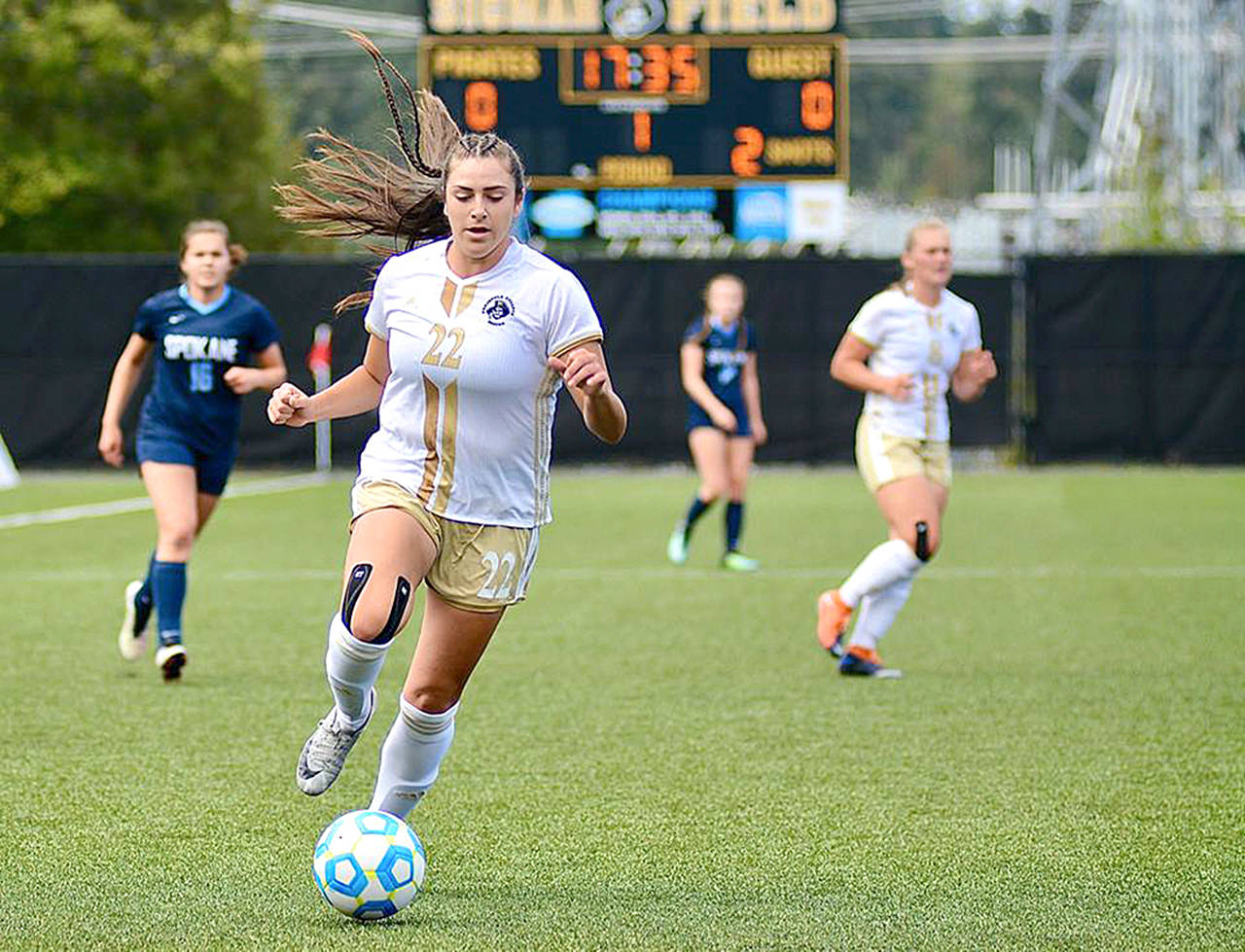 Jay Cline Peninsula’s Sam Guzman dribbles upfield during the Pirates’ 2-0 win over Spokane on Saturday at Wally Sigmar Field.