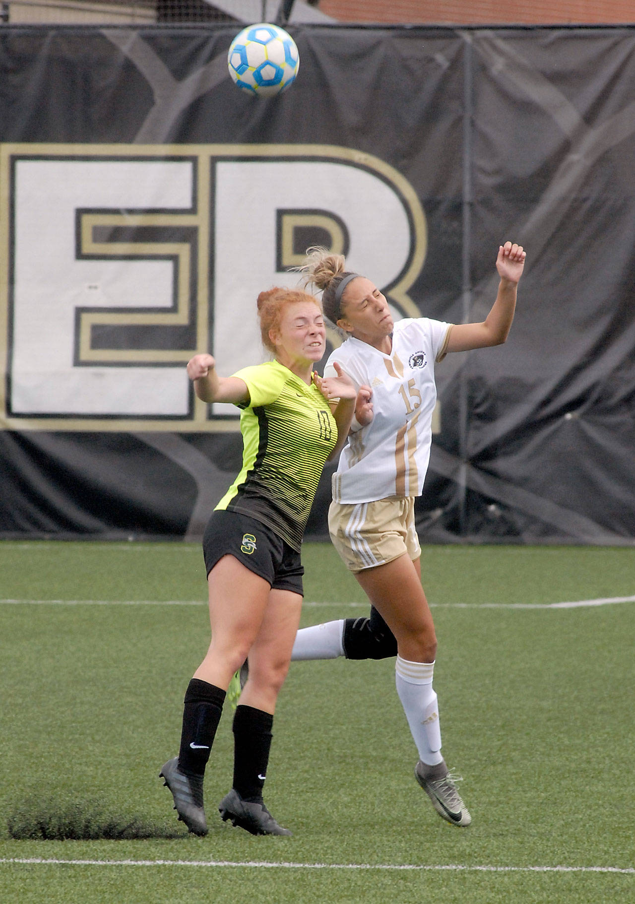 Keith Thorpe/Peninsula Daily News Shoreline’s Corrisa Stoneback-Schelling, left, and Peninsula’s Nicolette Paredes battle for a header during Saturday’s match at Wally Sigmar Field in Port Angeles.