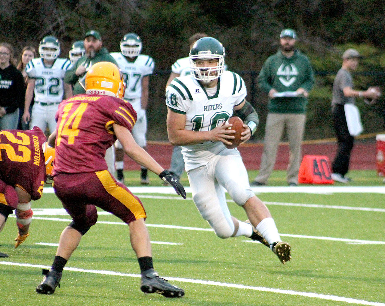 Port Angeles’ Brenden Roloson-Hines runs with the ball against Kingston. The Roughriders won the game 28-6 for their first win of the year. (Mark Krulish/Kitsap News Group)