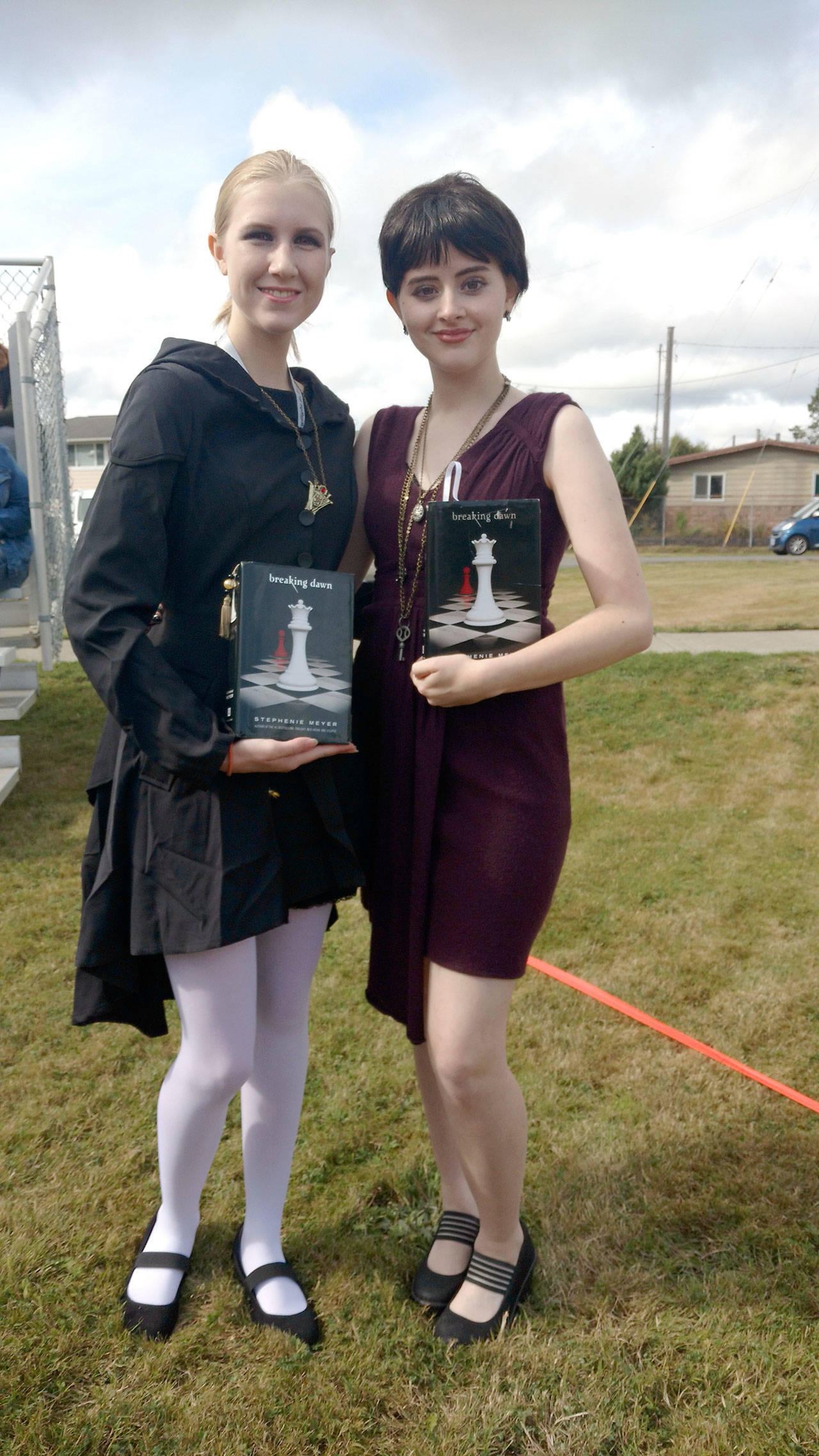 Trinity Hanning and Dominique LeFrancis pose before the official Fandom Family group photo during the Forever Twilight Festival on Friday morning. (Zorina Barker/for Peninsula Daily News)