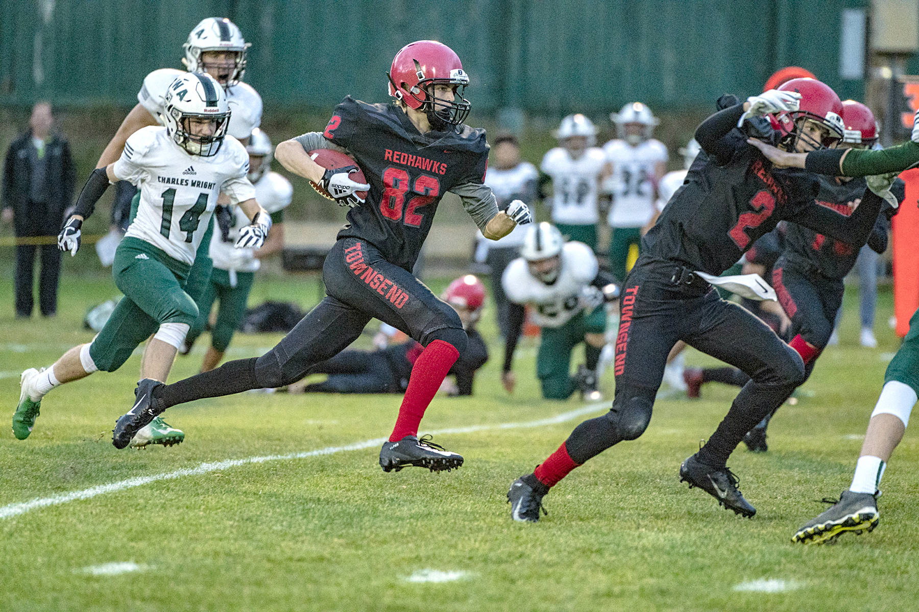 &lt;strong&gt;Steve Mullensky&lt;/strong&gt;/for Peninsula Daily News                                Port Townsend’s Emil Makkula picks up protection from Tanner Woodley before running for a touchdown Friday.