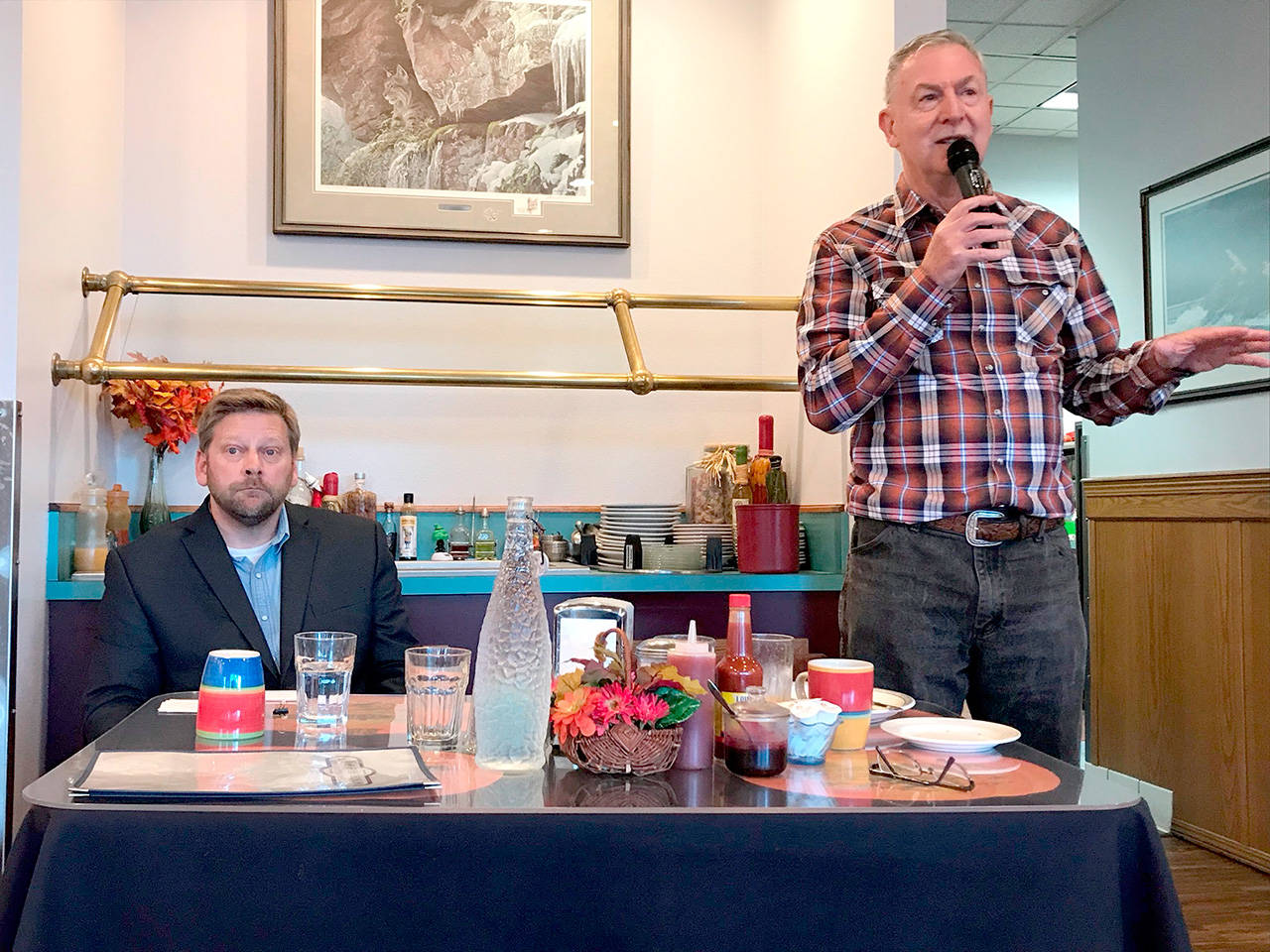 State Rep. Mike Chapman, left, and Don Hall of Sequim, representing Chapman’s challenger, Jodi Wilke, debated 24th District legislative issues Tuesday at an election forum. (Paul Gottlieb/Peninsula Daily News)