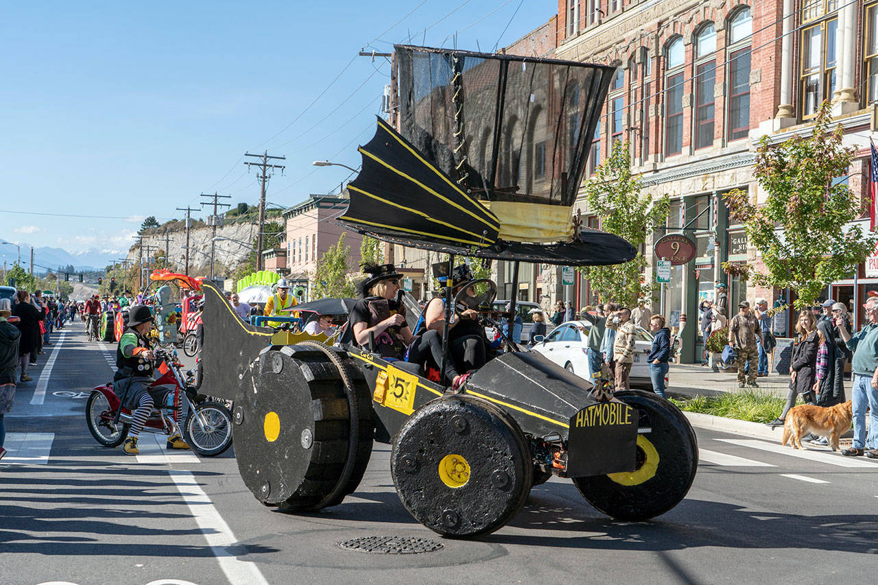 Hats Off, a Kinetics Skulpture entry from Gig Harbor, wheels down Water Street during the 36th annual Kinetics Skulpture Parade in downtown Port Townsend on Saturday. Thirteen floats from as far away as Chico, Calif., took part in the parade and will compete in a race today. (Steve Mullensky/for Peninsula Daily News)