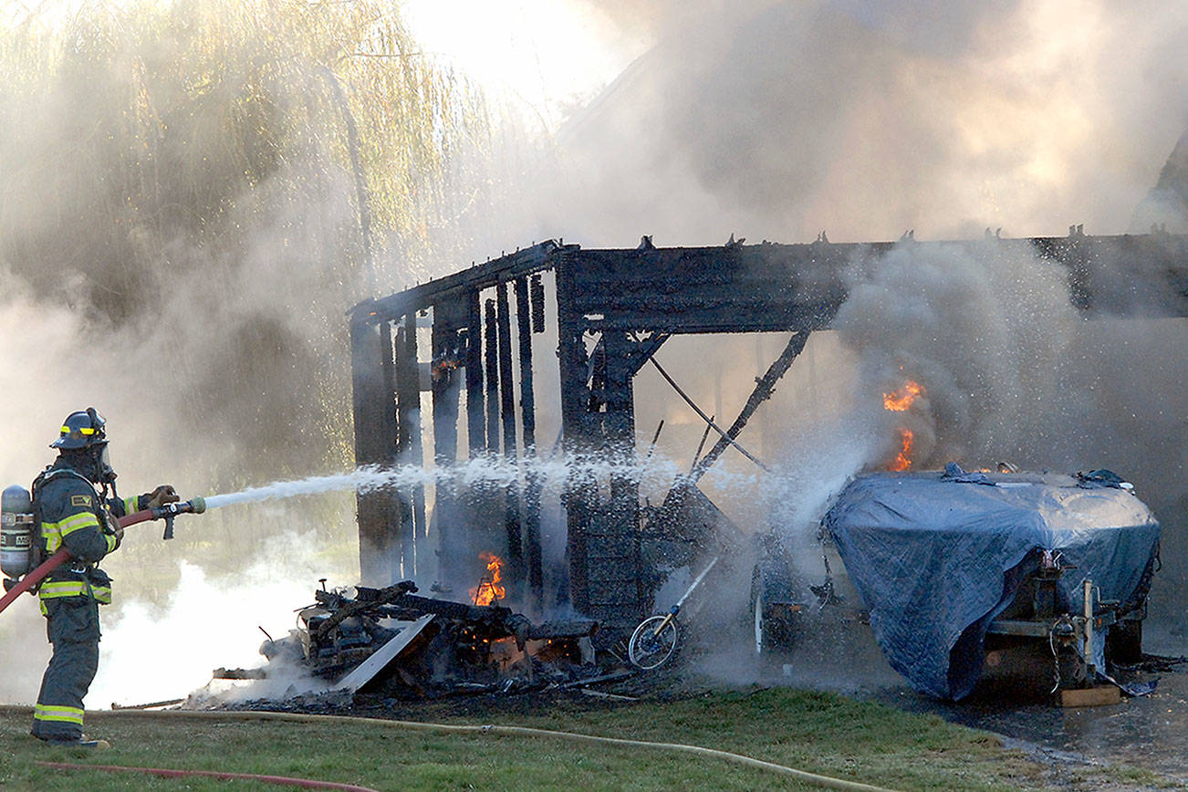 Port Angeles fire crews knock down blaze that endangered two homes