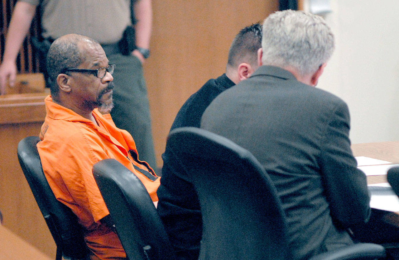 Tommy Ross Jr., left, sits with attorneys Joseph Wolfley and Lane Wolfley during Ross’ release proceeding in Clallam County Superior Court on Tuesday. (Keith Thorpe/Peninsula Daily News)