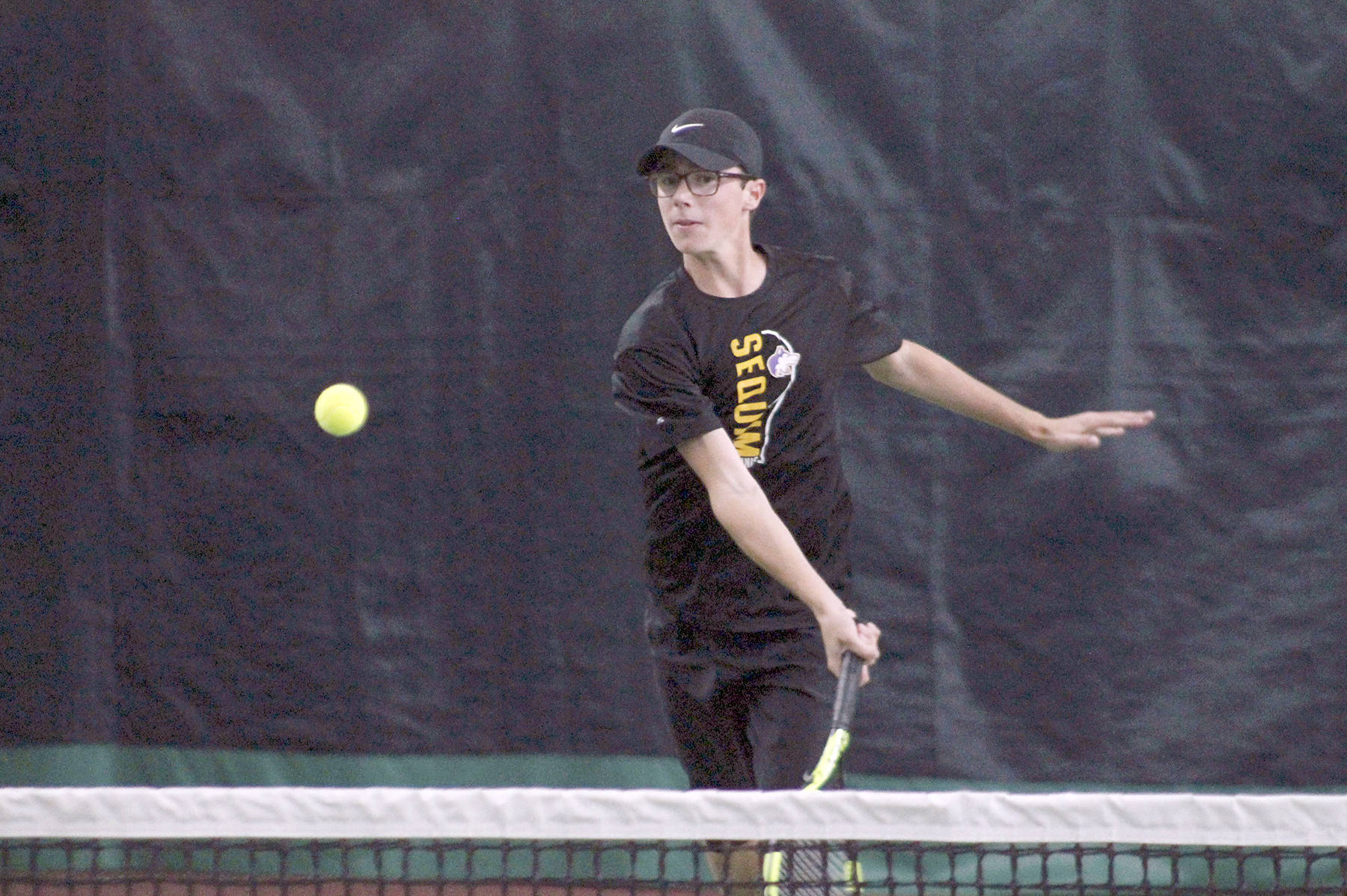 &lt;strong&gt;Mark Krulish&lt;/strong&gt;/Kitsap News Group                                Sequim’s Damon Little returns a shot during a West Central District Tournament doubles match at Kitsap Tennis and Athletic Center in Bremerton. Little and partner Liam Payne finished third and qualified for the state tournament in May.