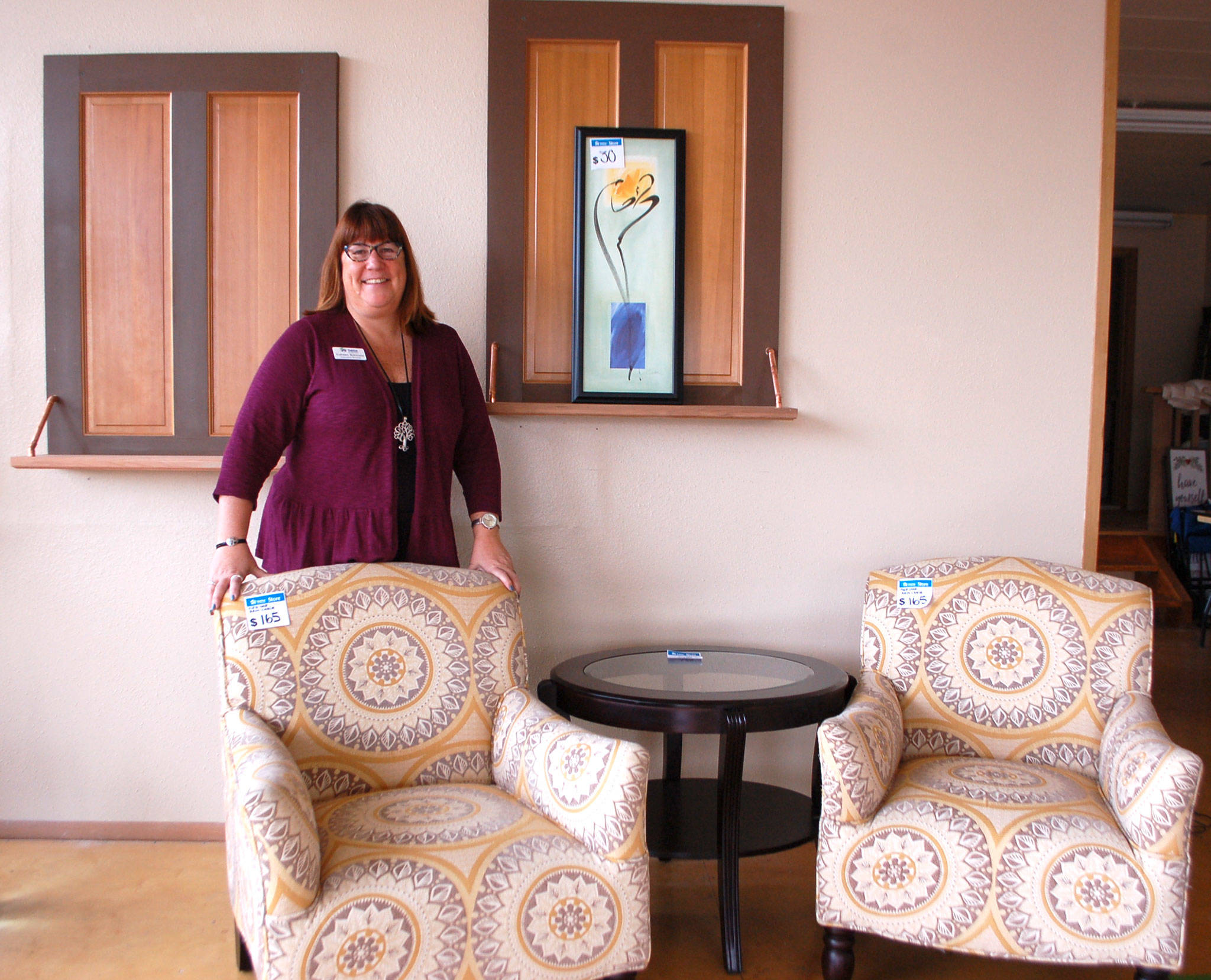 Colleen Robinson, executive director of Habitat for Humanity of Clallam County, stands in the nonprofit’s new vintage boutique in Sequim where staff also moved its main Sequim office. The new store is tentatively set to open sometime in mid-November. (Erin Hawkins/Olympic Peninsula News Group)