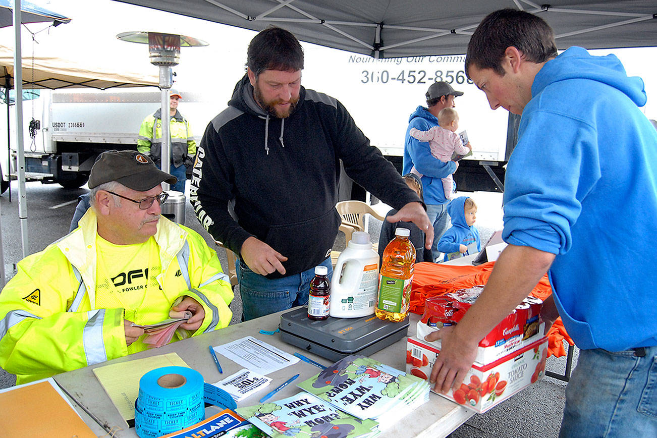 PHOTO: Weighing donations at Lakeside food drive