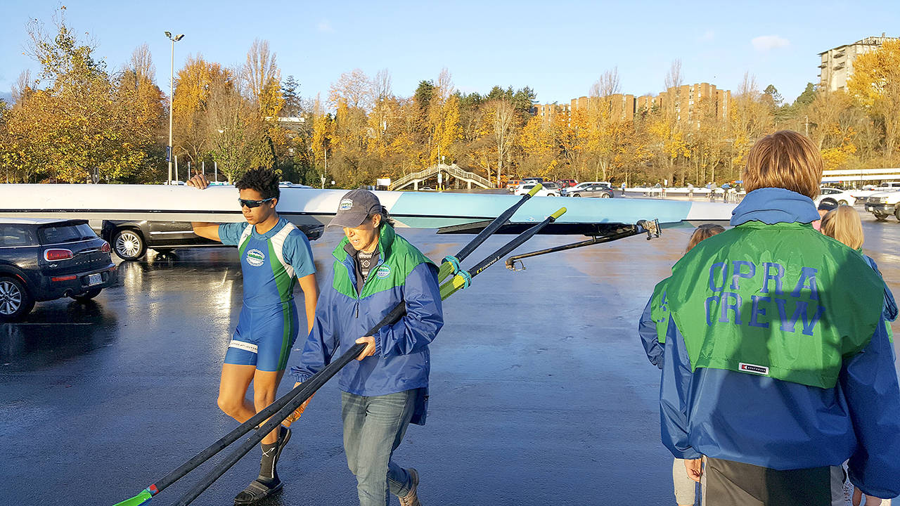 Nathan Mishler gets final advice from coach Deborah Swinford as he takes his boat out for his Men’s Junior 1x race.