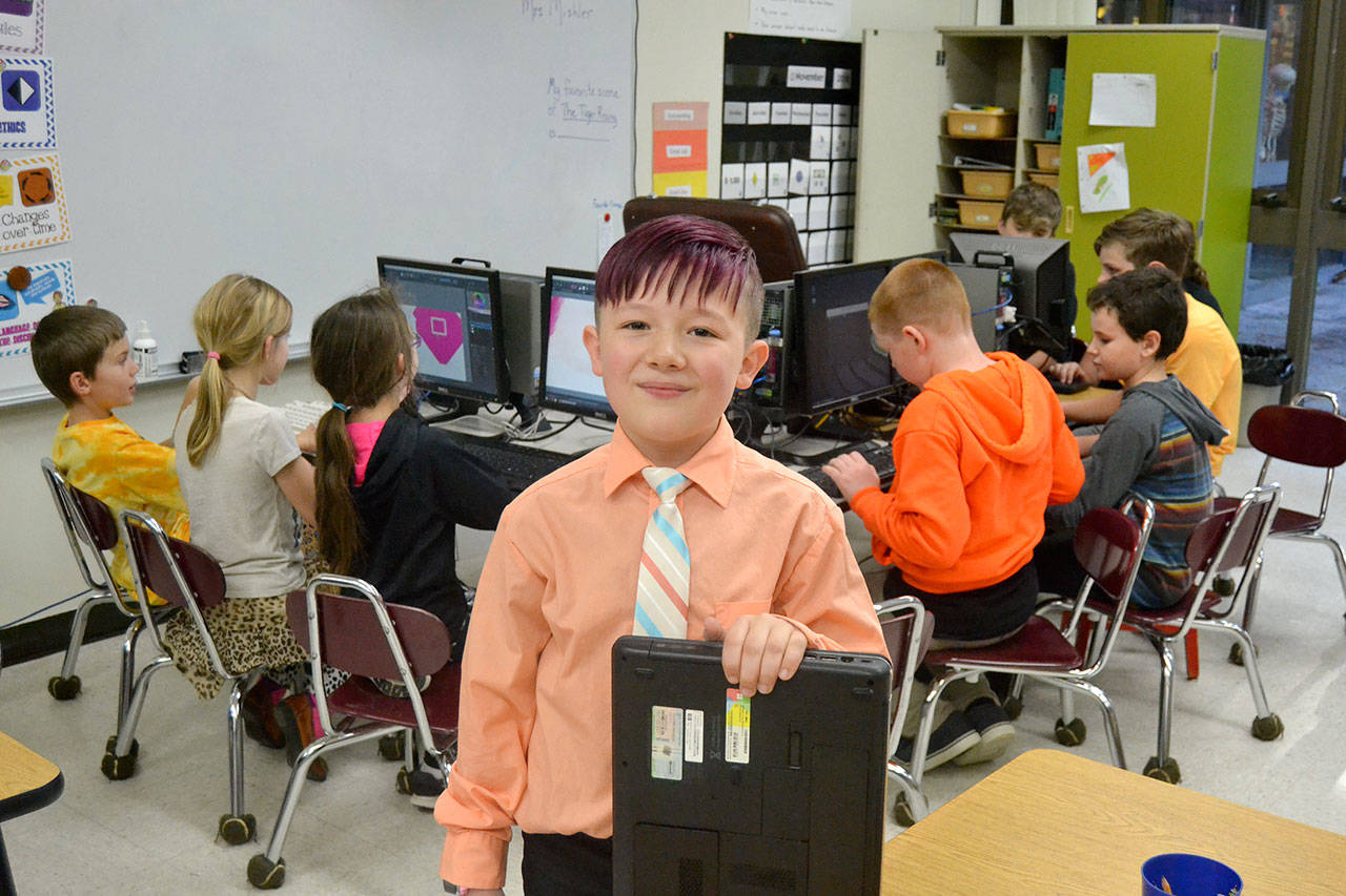 Port Angeles’ Aiden Johnson, 8, a member of the Sequim PC Users Group, builds computers for people in need. Through the group’s help, he also helped start Roosevelt Elementary School’s Computer Club. (Matthew Nash/Olympic Peninsula News Group)