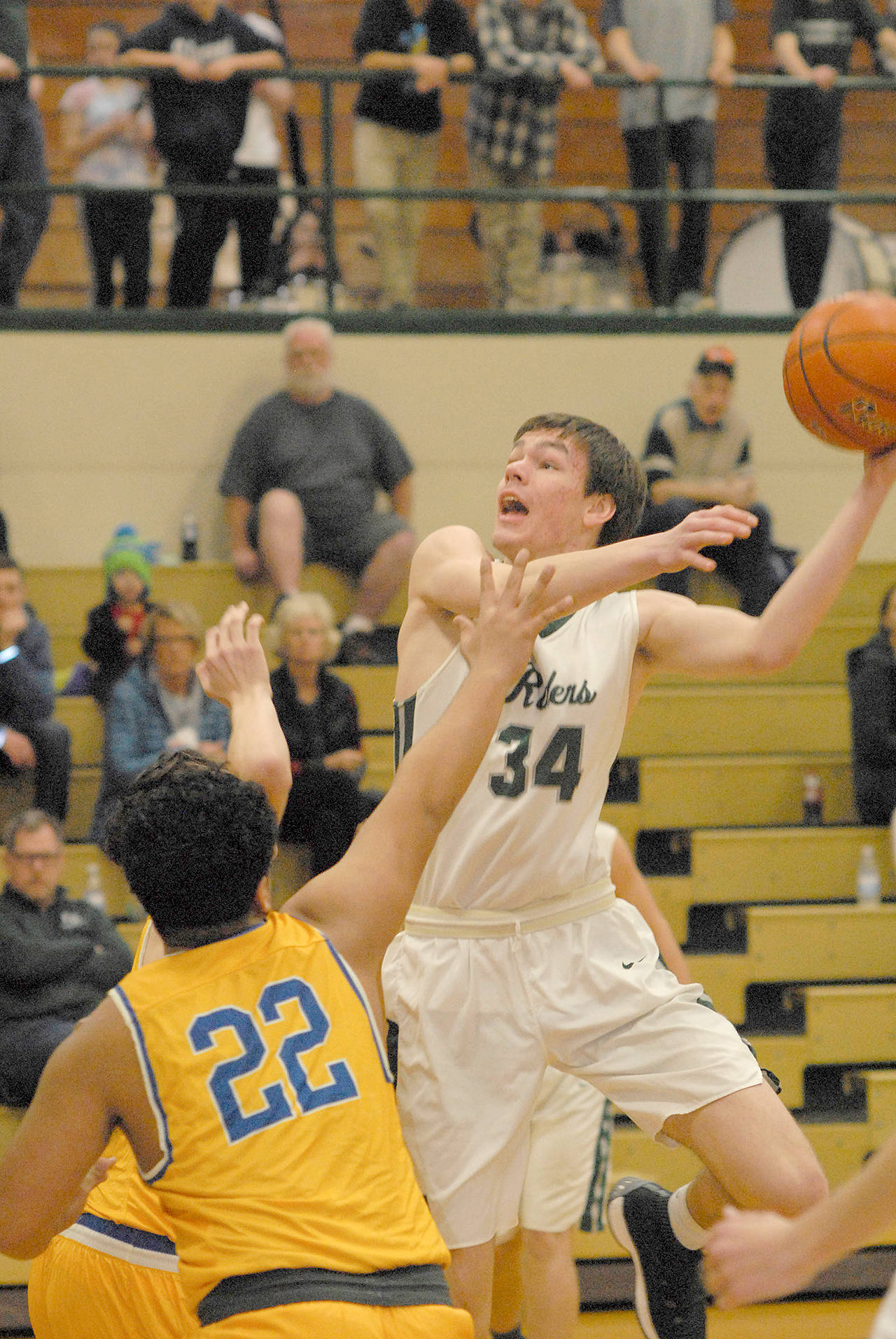Keith Thorpe/Peninsula Daily News Port Angeles senior center Liam Clark returns to anchor the Roughriders inside.