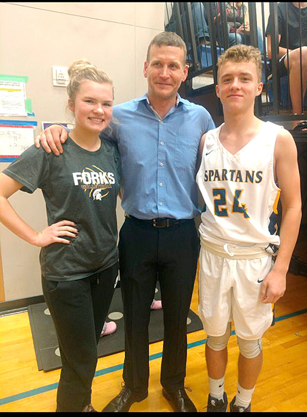2000 Forks High School graduate Kurt Olson (middle) was inducted into the Forks High School Athletic Hall of Fame last Friday. Olson is joined by his niece, Jayden Olson, a member of the Spartans’ girls basketball team and his nephew Logan, a Forks boys basketball player.