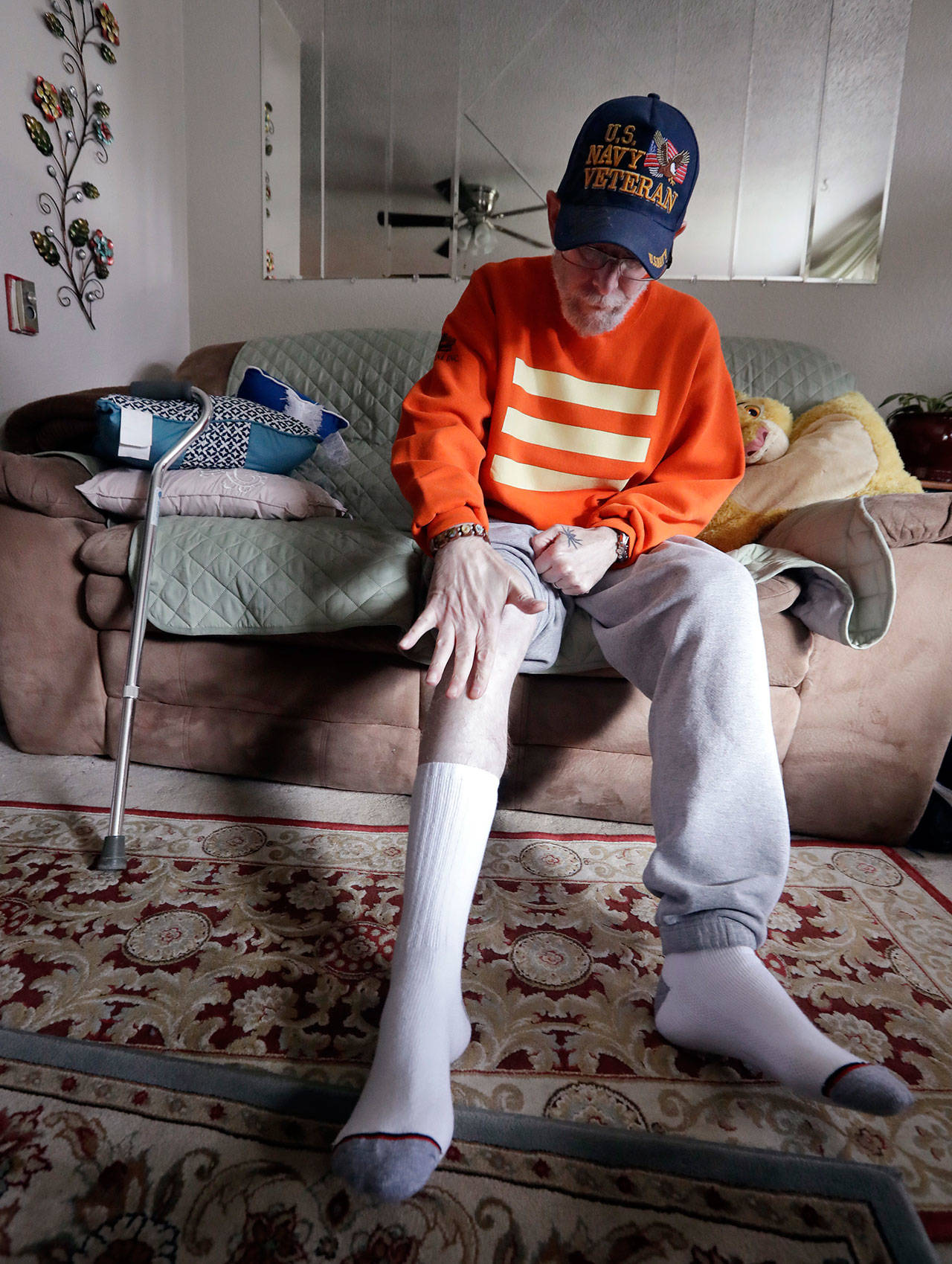 In this photo taken Oct. 30, Western State Hospital nurse Larry Herbert talks about the injury he received after being assaulted by a patient there, as he recovers at his home in Bremerton. (Elaine Thompson/The Associated Press)