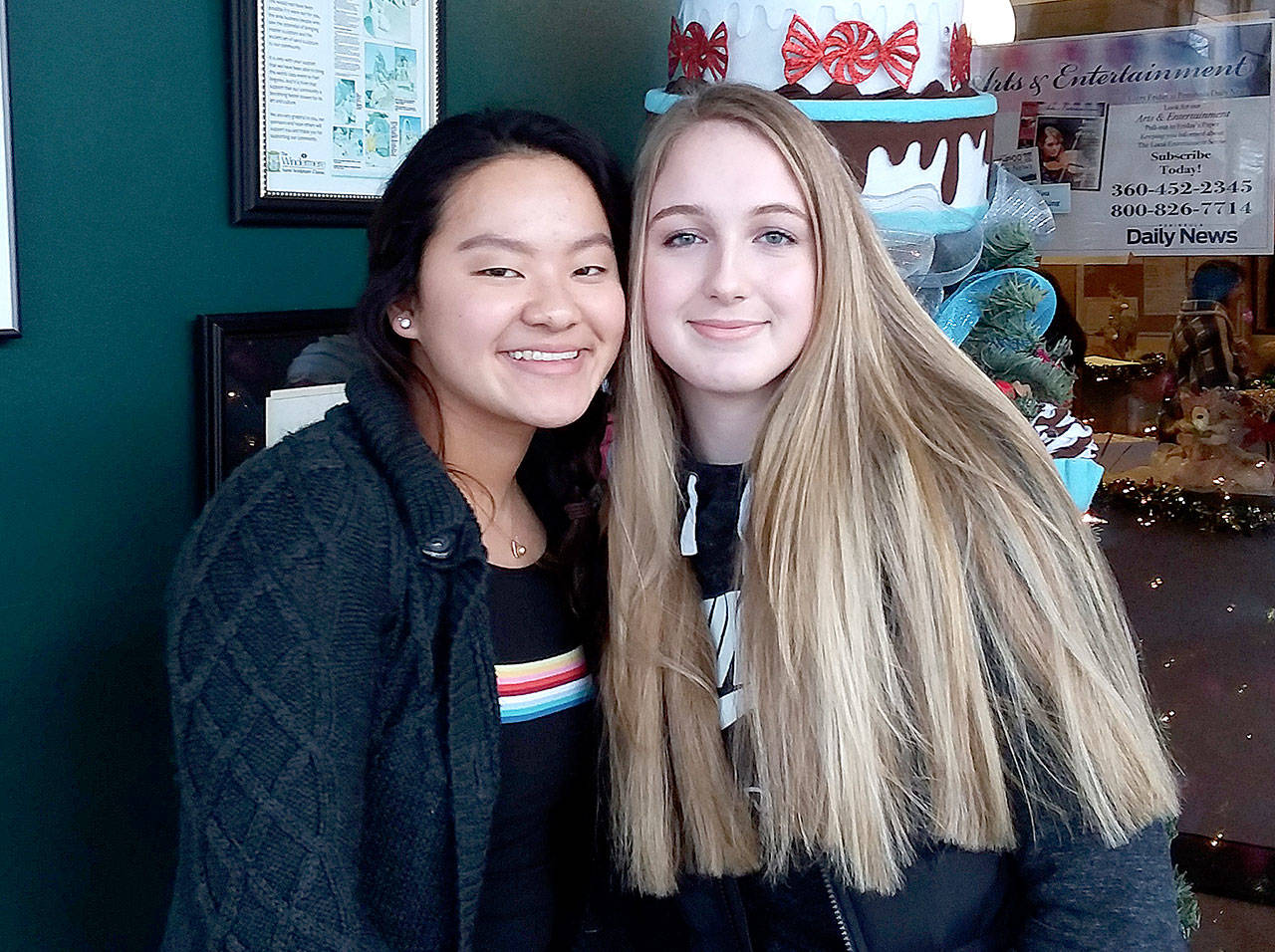 Port Angeles swimmers Felicia Che, left, and Nadia Cole have gone to the state 2A swim meet three years in a row. They combined for 44 first-place individual and relay finishes this past season. (Pierre LaBossiere/Peninsula Daily News)