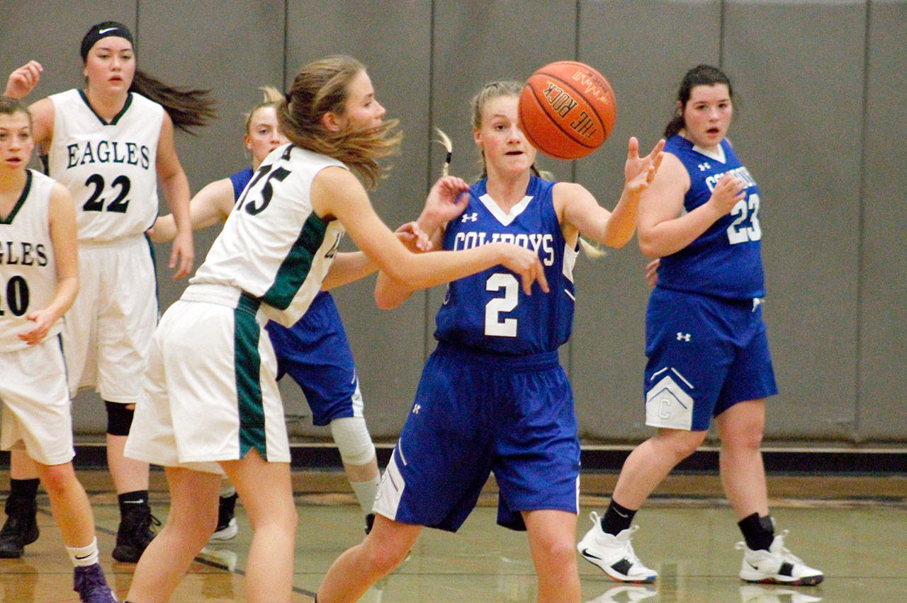 Mark Krulish/Kitsap News Group Chimacum’s Jada Trafton, 2, comes up with a steal during the Cowboys’ win over Klahowya on Friday.