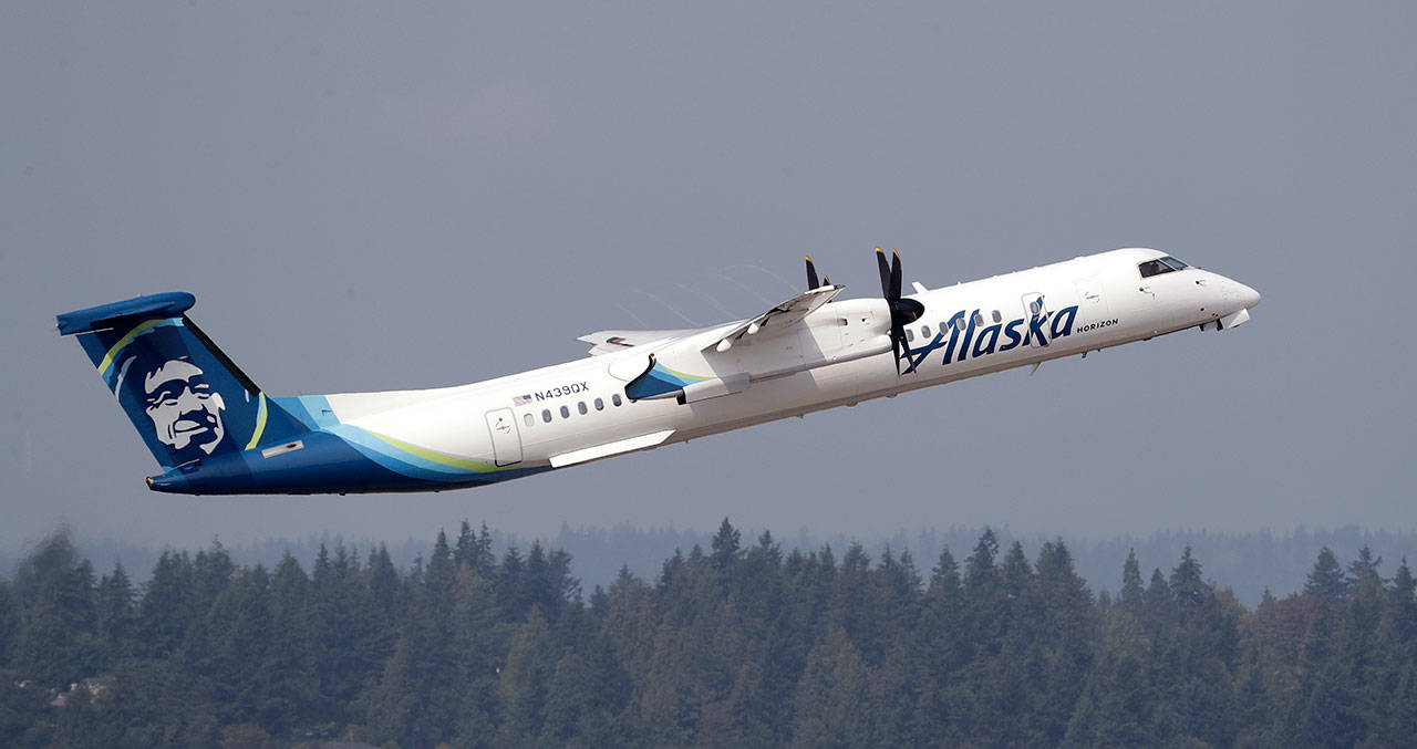 In this file photo, a Horizon Air Q400 turboprop airplane, part of Alaska Air Group, takes off from Seattle-Tacoma International Airport. (The Associated Press)
