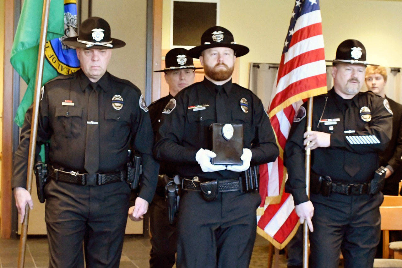 Port Townsend Police Officers Drew Radford, left, Mark Drummond, Jeremy Vergin and Nate Holmes served as color guard for Reserve Sergeant Dave Winegar’s memorial service Friday at Fort Worden. (Jeannie McMacken/Peninsula Daily News)
