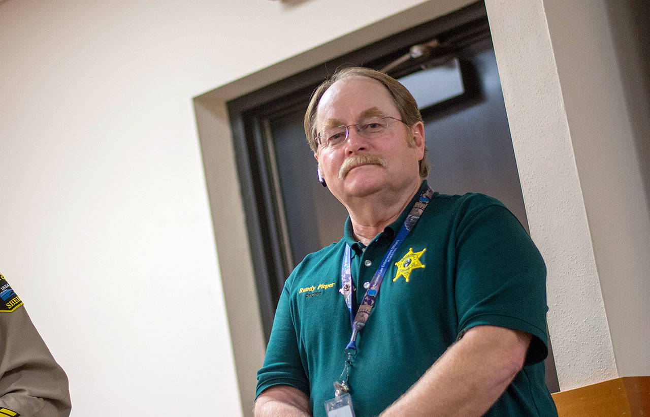 Clallam County Sheriff’s Sgt. Randy Pieper, who recently retired from patrol, was honored for his 43 years of service to the county during the Board of County Commissioners meeting Tuesday. (Jesse Major/Peninsula Daily News)