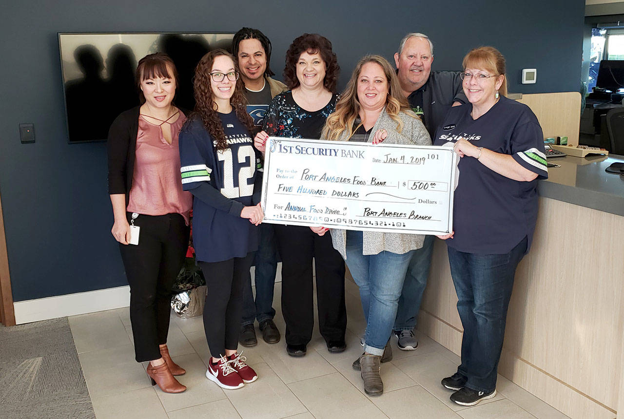 PHOTO: Food, funds donation banked in Port Angeles