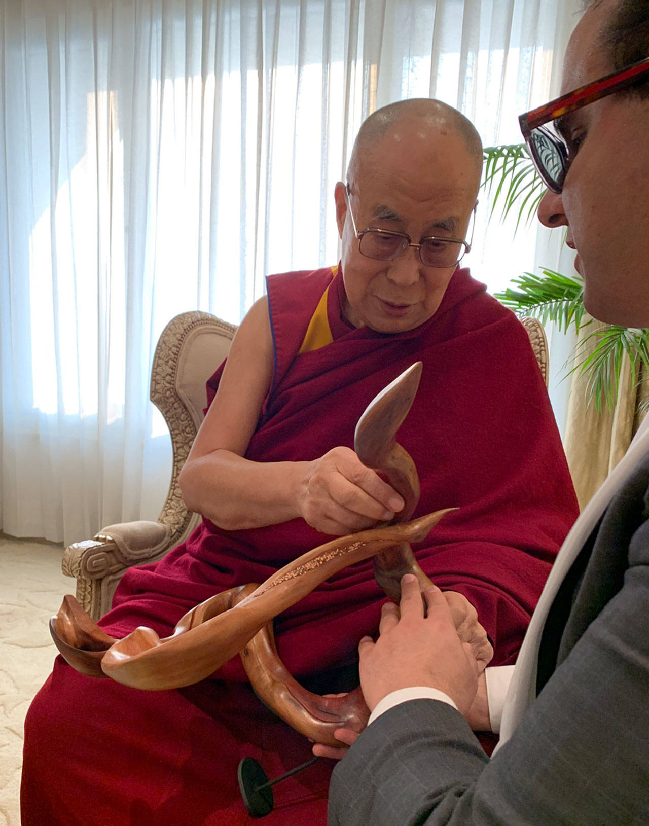 the Office of the Lt. Governor                                Lt. Governor Cyrus Habib presents the Dalai Lama a driftwood art piece in December created by Sequim artist Tuttie Peetz. She was contacted by Habib’s office to donate some art for the trip because they felt driftwood is a good representation of Washington’s environment.
