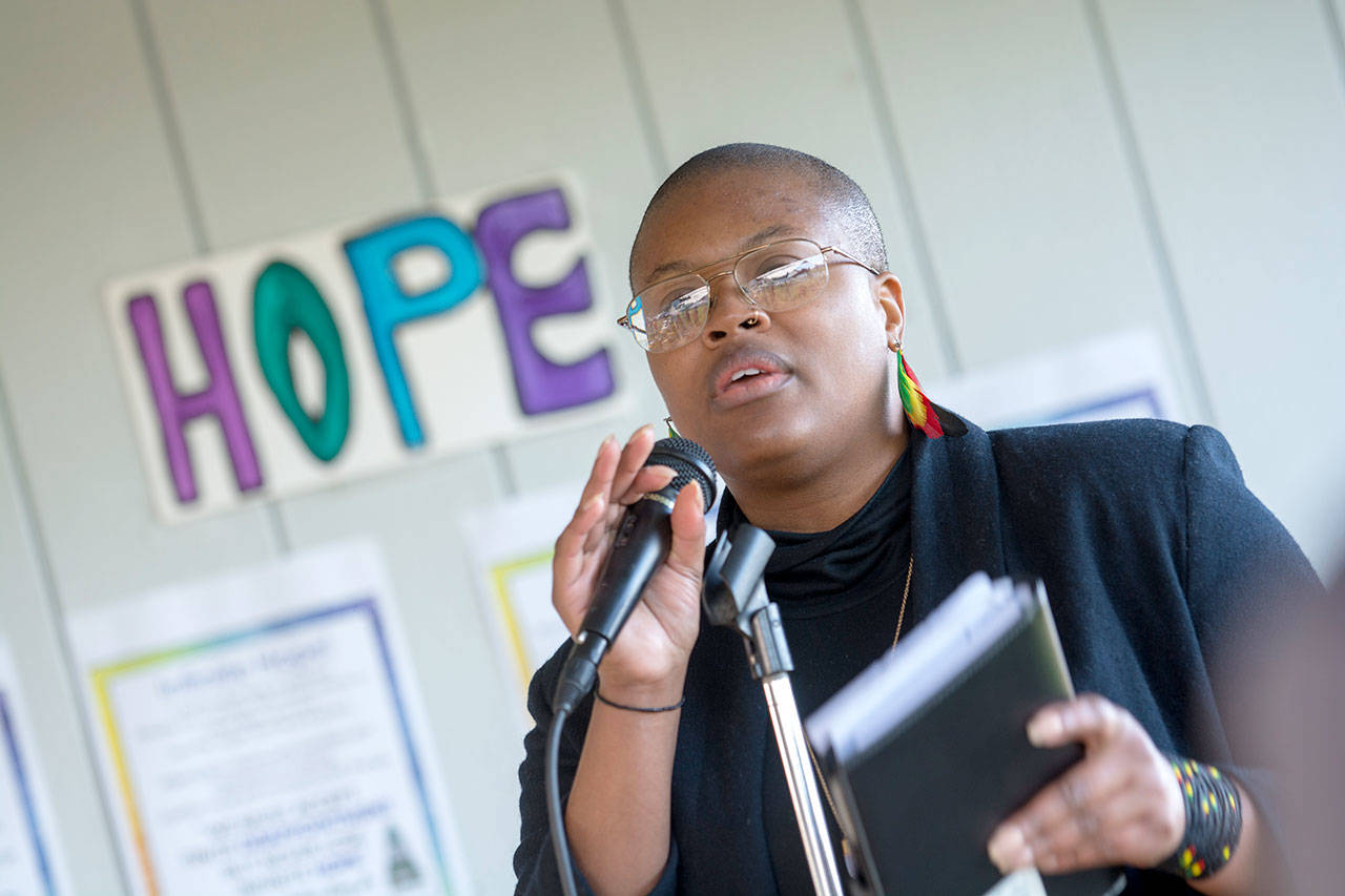 Shewa Dedeke of Port Angeles shares quotes from Martin Luther King Jr. during a community celebration honoring him and his work at Lions Park on Monday. (Jesse Major/Peninsula Daily News)