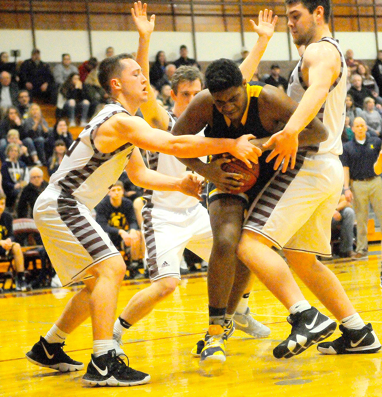 Hasani Grayson /Grays Harbor News Group Forks’ Trey Baysinger, center, is swarmed by Montesano defenders.