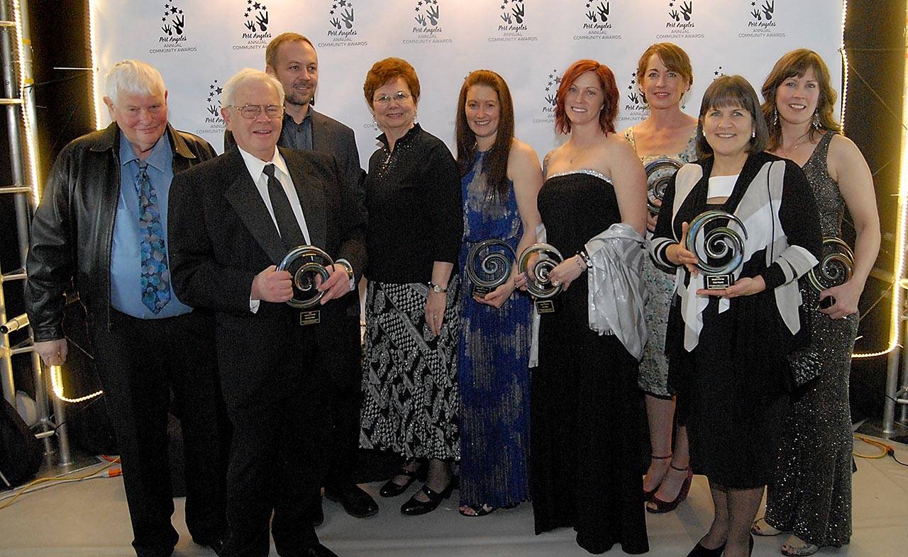 The recipients of the 2018 Port Angeles Community Awards were, from left, Fred Hermann, Bill Hermann, Mike Hermann and Kay Hermann of Herman Brothers, Business of the Year; Victoria Jones, Young Leader of the Year; Amy Miller for Citizen of the Year; Kayla Oakes of Juan de Fuca Festival of the Arts, Organization of the Year; Claire Rausch, Educator of the Year; and Jenny Stewart Houston of Poser Yoga, Emerging Business of the Year. (Keith Thorpe/Peninsula Daily News)