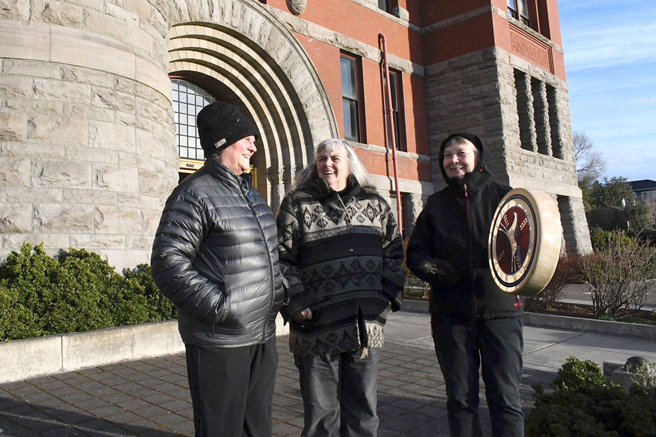 Barbara Moore-Lewis, left, Julia Cochrane and Lys Burden held a vigil outside of the Jefferson County Courthouse on Monday to bring attention to the decisions made by the county commissioners last year over the Pleasant Harbor Master Planned Resort in Brinnon. They are concerned about the development’s impact and the possible destruction of the Kettles, a natural formation of ponds that has cultural significance to the Port Gamble S’Klallam Tribe. (Jeannie McMacken/Peninsula Daily News)