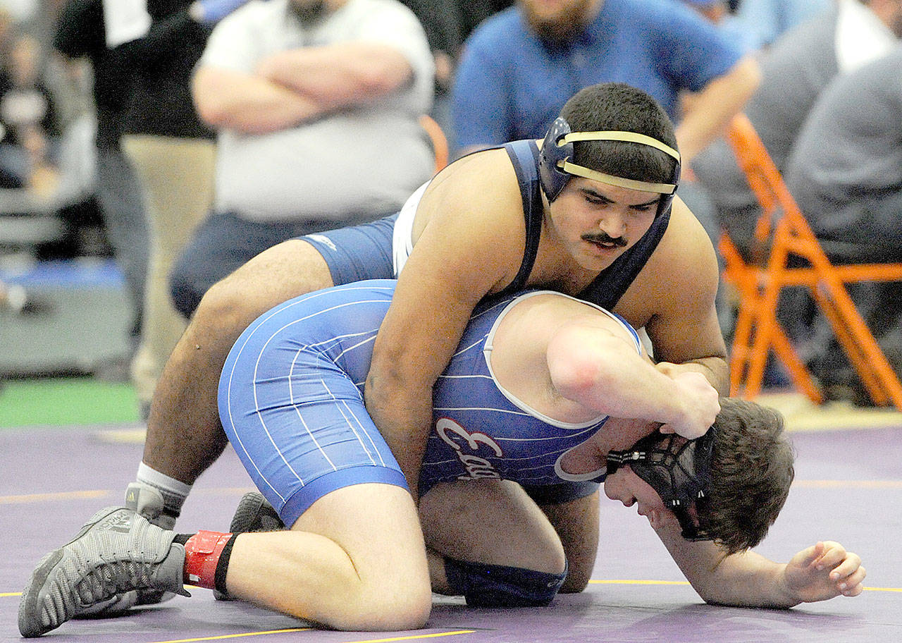 Lonnia Archibald/for Peninsula Daily News Eden Cisneros of Forks wrestlers against an opponent at the District 4 Subregionals in Centralia earlier this month.