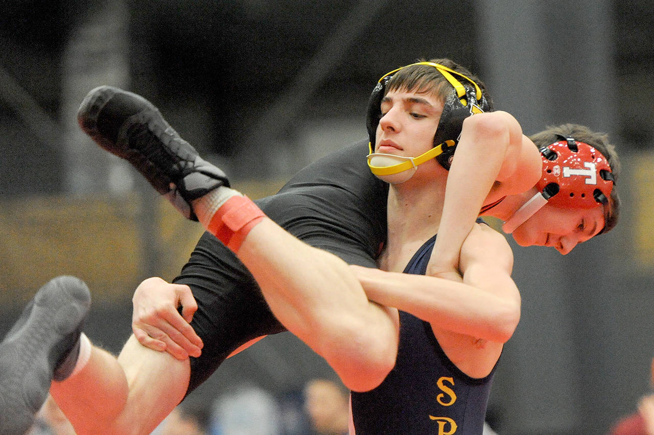 Lonnie Archibald/for Peninsula Daily News Forks’ Jake Weakley pinned his Tenino opponent in the 120-pound weight class during a subregional meet earlier this month. Weakley and other North Olympic Peninsula boys and girls wrestlers will compete at Mat Classic XXXI today and Saturday at the Tacoma Dome.