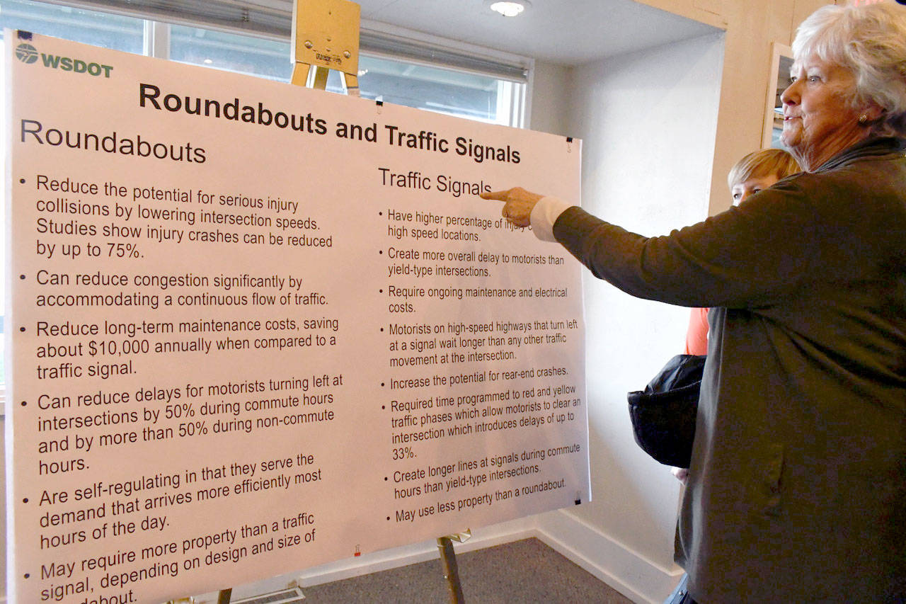 Jeanie Killmer of Port Ludlow discusses the merits of a roundabout at the Paradise Bay Road and state Highway 104 intersection with others who attended an open house Thursday afternoon. (Jeannie McMacken/Peninsula Daily News)