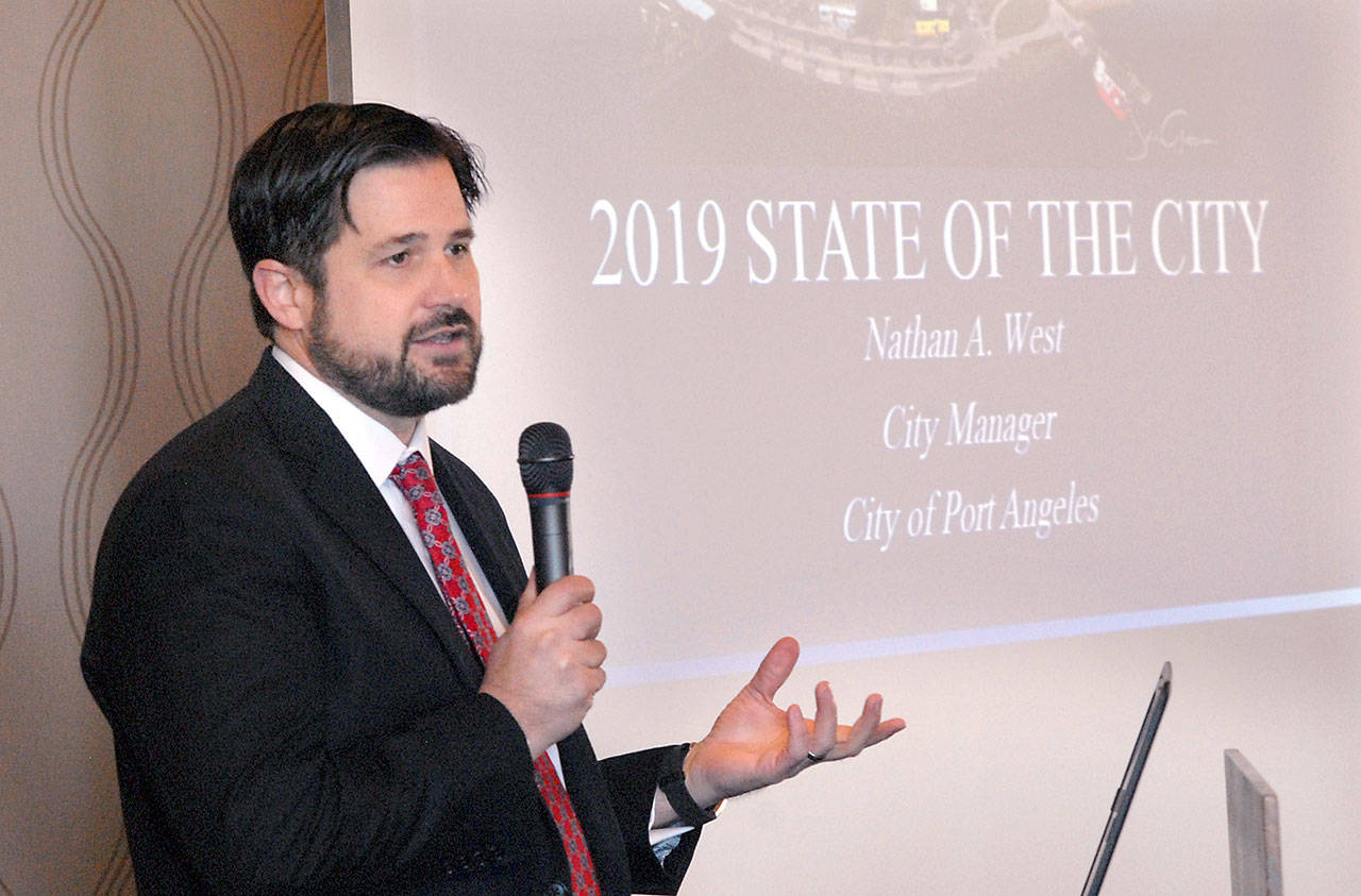 Port Angeles City Manager Nathan West delivers his State of the City address during Wednesday’s Port Angeles Regional Chamber of Commerce luncheon at the Red Lion Hotel. (Keith Thorpe/Peninsula Daily News)