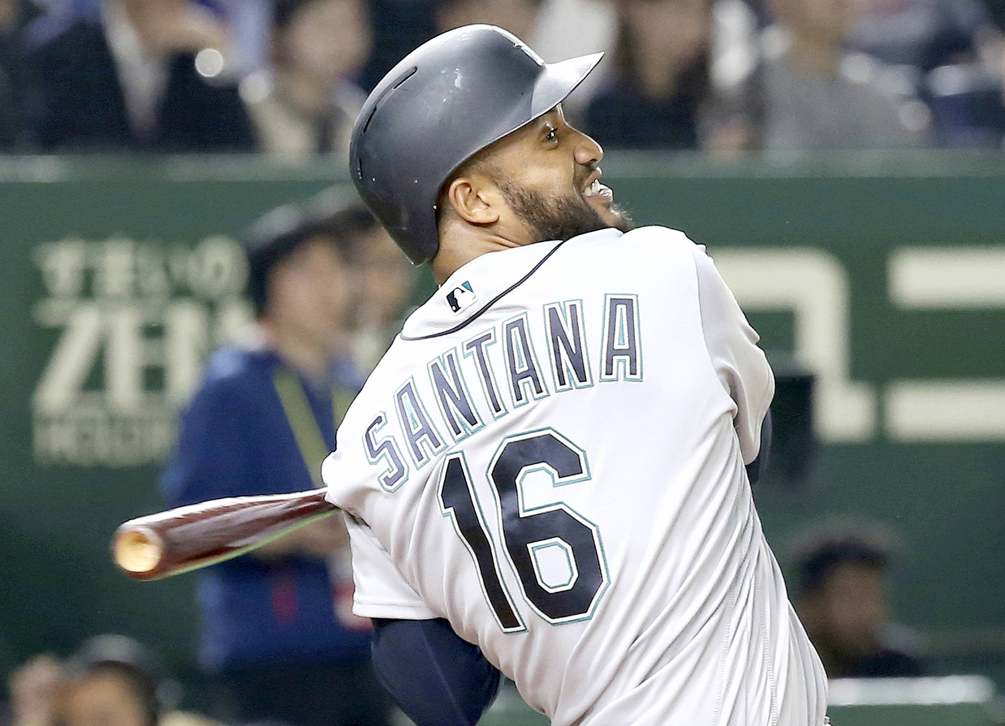 Seattle Mariners’ Domingo Santana hits a grand slam off Oakland Athletics starter Mike Fiers in the third inning of Game 1 of their Major League opening series baseball game at Tokyo Dome in Tokyo on Wednesday. (AP Photo/Koji Sasahara)