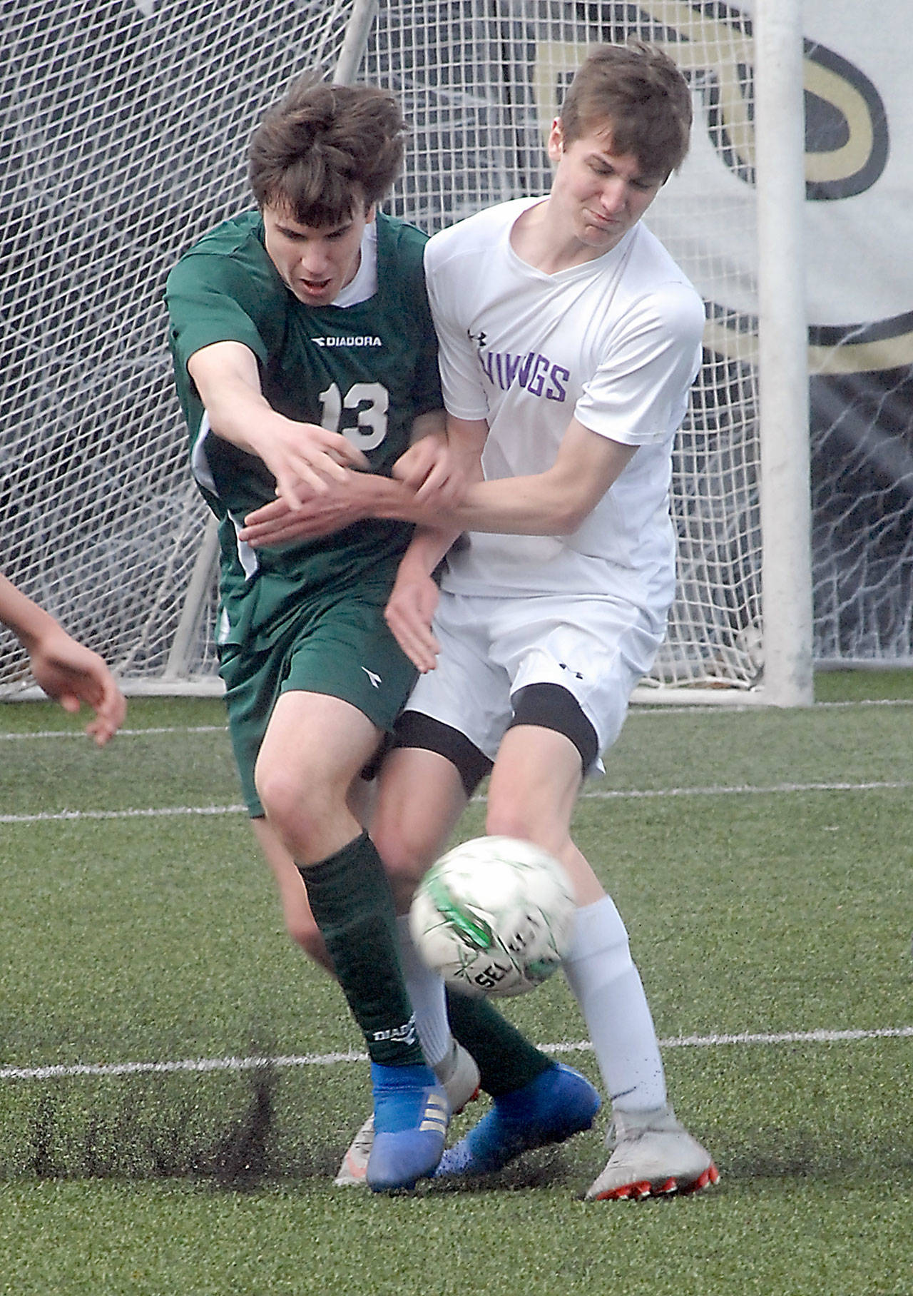 Port Angeles’ Stuart Methner, left, and North Kitsap’s Cameron Peaslee battle for the ball during Saturday’s match at Peninsula College in Port Angeles. Keith Thorpe/Peninsula Daily News