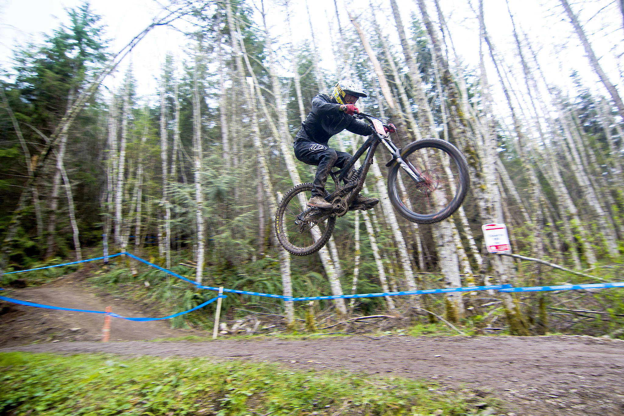 A biker makes his way toward the finish line at the NW Cup downhill racing competition in Port Angeles in 2018. Jesse Major/Peninsula Daily News