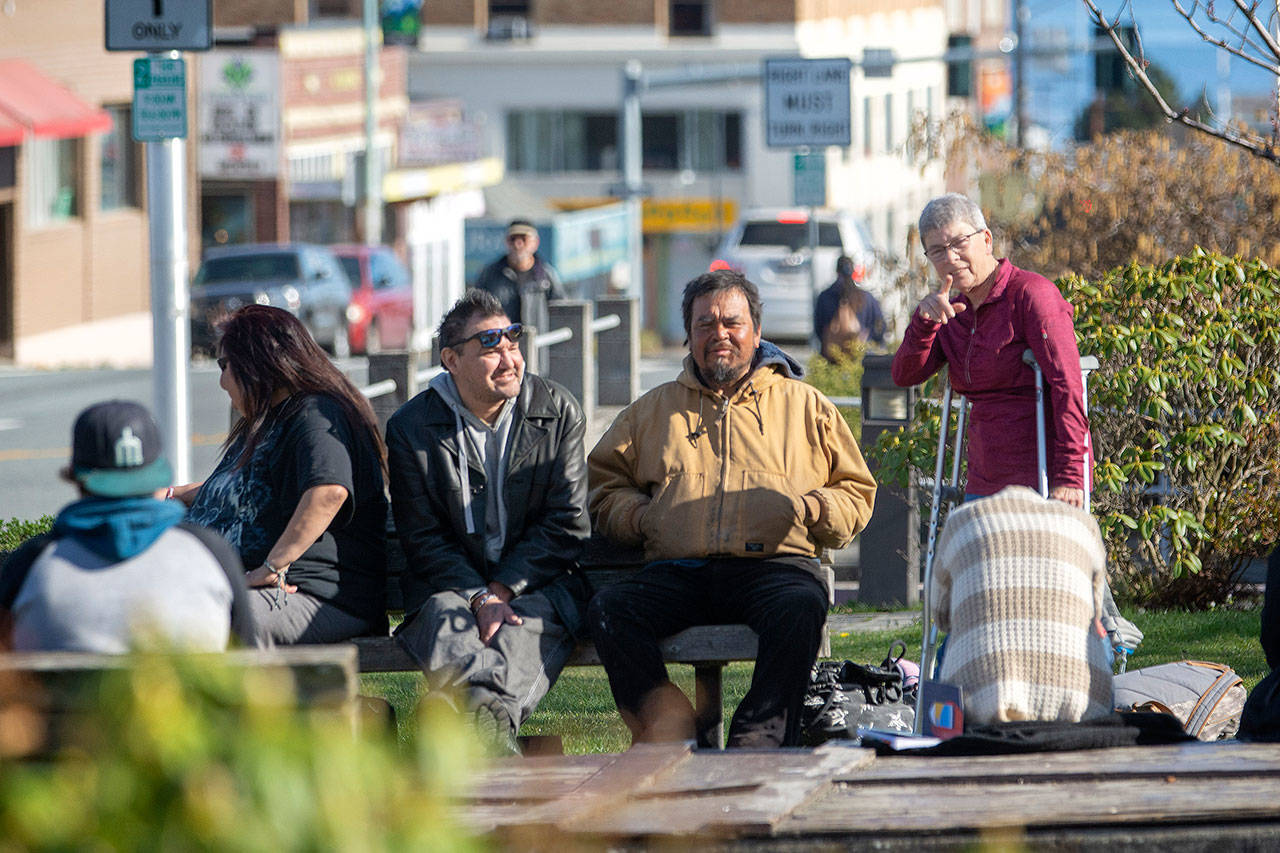 Patty Pastore talks to people at Veterans Memorial Park on Monday. Pastore has been involved in an effort to keep the park clean. (Jesse Major/Peninsula Daily News)