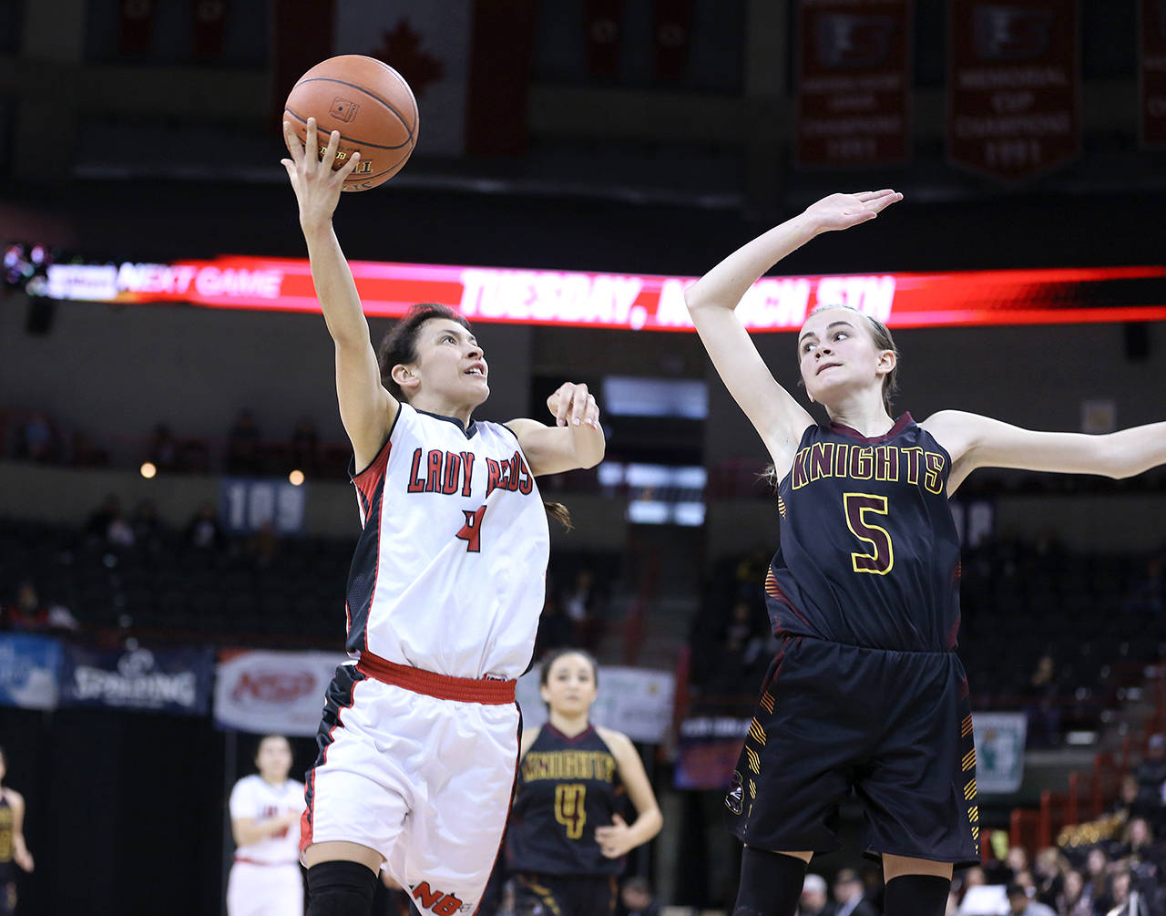 Chris Johnson/for Peninsula Daily News Neah Bay’s Laila Greene, left, shoots while defended by Sunnyside Christian’s Sydney Banks. Greene has been picked to the Peninsula Daily News’ All-Peninsula girls basketball team.