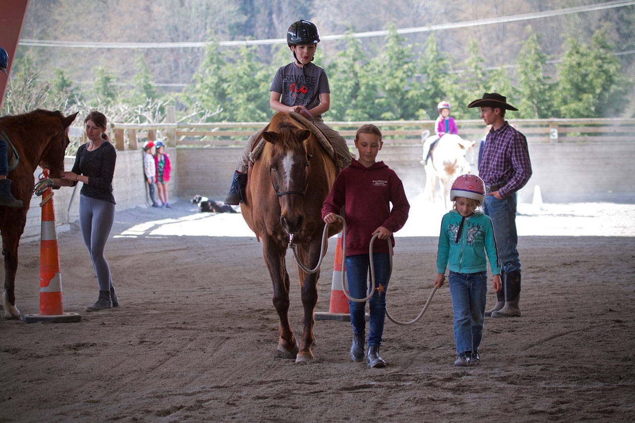 Children experienced springtime weather and horse time while learning the basics of horsemanship during Freedom Farm’s Spring Break Horsemanship Camp earlier this month. (Kip Tulin)
