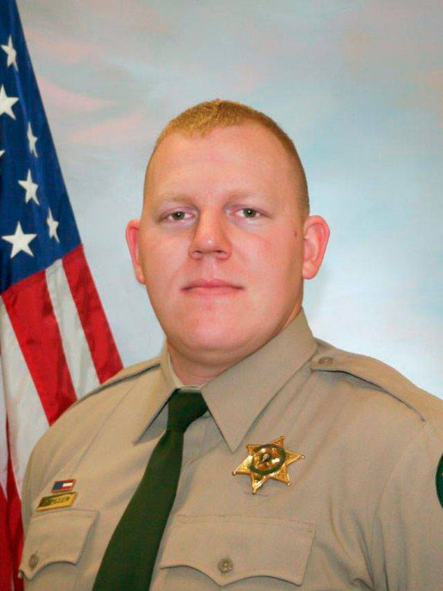 Cowlitz County Sheriff’s Office Deputy Justin DeRosier, 29, was shot and killed Saturday while checking on a disabled vehicle northeast of Kalama. (Cowlitz County Sheriff’s Office/The Columbian via AP)
