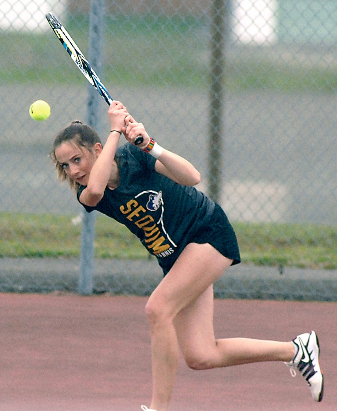 Keith Thorpe/Peninsula Daily News Sequim’s Isabelle Hugoniot returnes the ball during Tuesday’s match against Port Angeles’ Summer Olsen at Port Angeles High School.