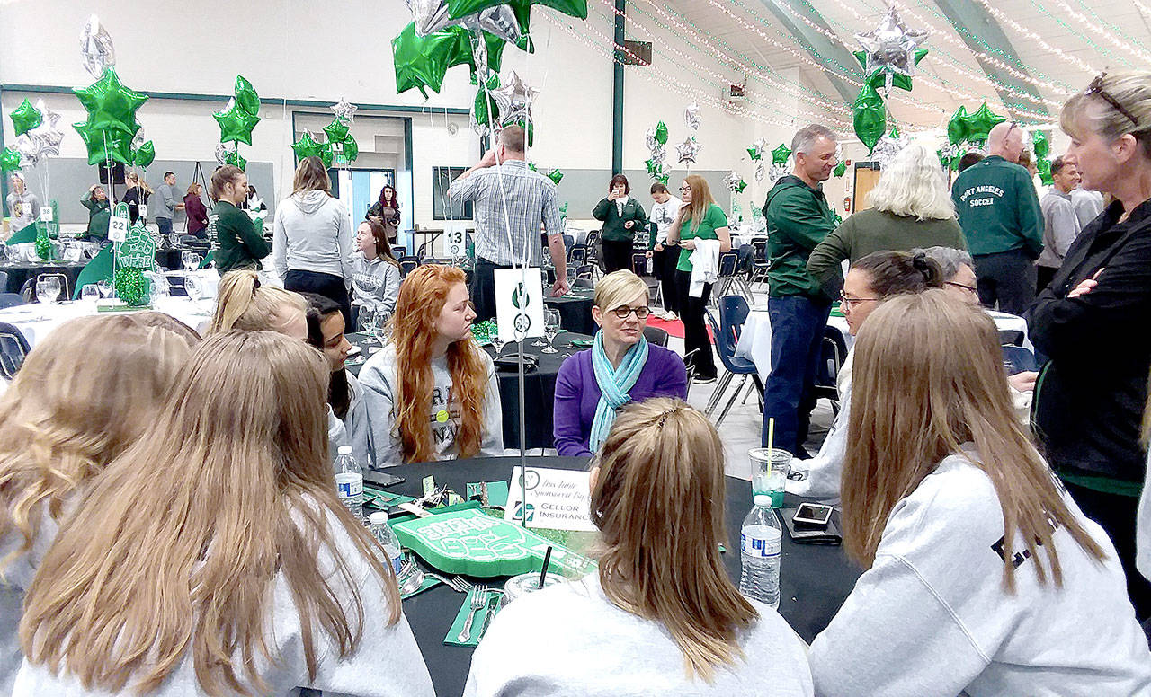Pierre LaBossiere/Peninsula Daily News Port Angeles Roughrider Hall of Famer Leigh Morgan speaks with the school’s girls tennis team at a breakfast held Saturday at the Vern Burton Community Center. Morgan, who was inducted into the hall of fame as an individual last year, is being inducted again this year as a member of the state champion 1985 girls tennis team.
