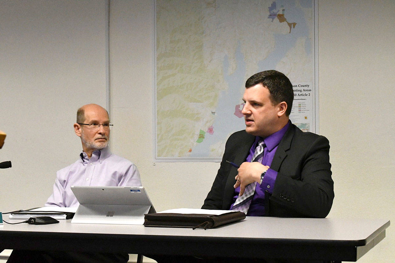 Jefferson County Administrator Philip Morley and county Prosecuting Attorney James Kennedy, right, explain to the county commissioners Monday that Port Townsend does not generate enough cases to support its own prosecutor and that county prosecutors will be able to handle the additional workload. The commissioners agreed to an interlocal agreement with the city that provides the service for $70,000 per year for three years. (Jeannie McMacken/Peninsula Daily News)