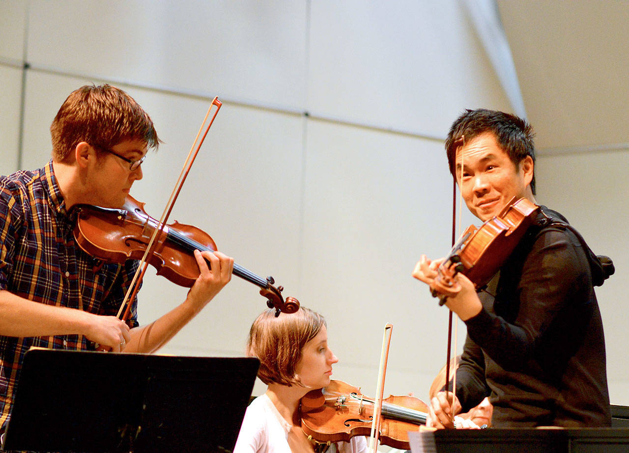 Richard O’Neill, right, is seen here rehearsing with James Garlick and Heather Ray for a 2017 concert. O’Neill and Ray will reunite with the Port Angeles Symphony in concert this Saturday. (Diane Urbani de la Paz/for Peninsula Daily News)