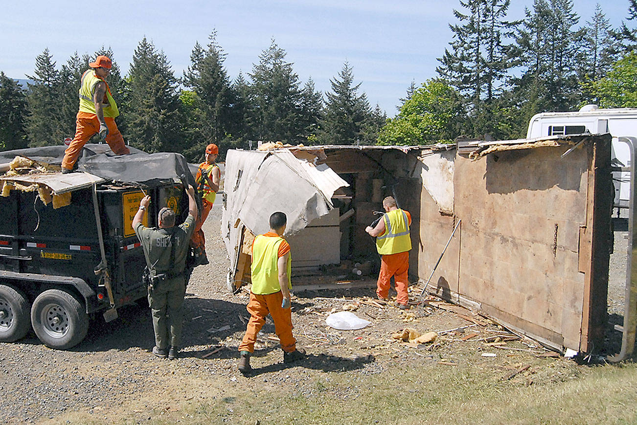 PHOTO: Chain gang dismantles an RV near Port Angeles