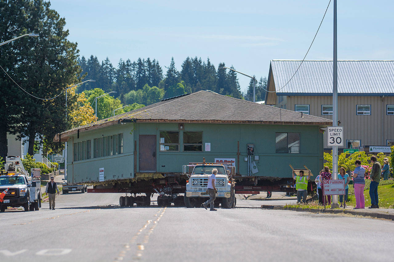Peninsula Behavioral Health’s Horizon Center turns onto Eighth Street as it moves to its new home at 223 E. Eighth St. on Thursday. (Jesse Major/Peninsula Daily News)