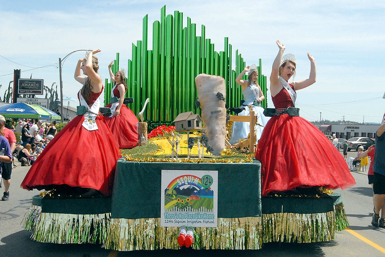 Sequim Irrigation Festival royalty, from left, princesses Brianna Cowan and Kjirstin Foresman, Queen Emily Silva and Princess Shelby Wells preside over Saturday’s Grand Parade from their float as it rolls down the parade route, following the theme “There’s No Place Like Home.” (Keith Thorpe/Peninsula Daily News)