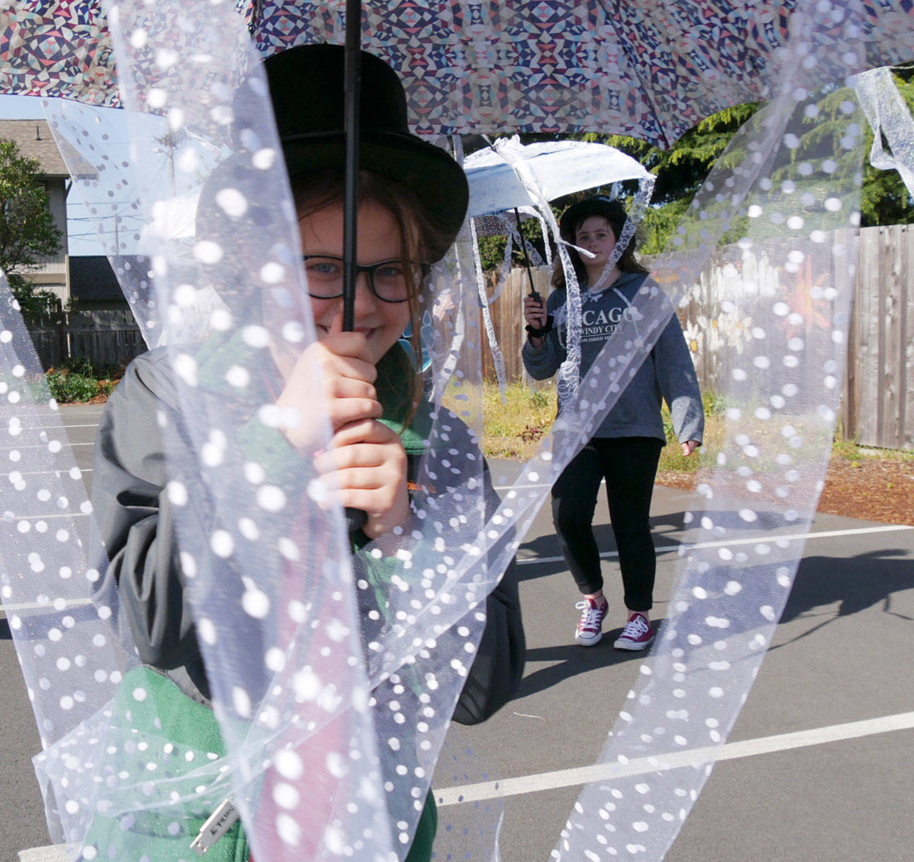 Lillian Anderson, 10, practices a jellyfish dance with fellow students in Olympic Theatre Arts’ parking lot. (Olympic Theatre Arts)